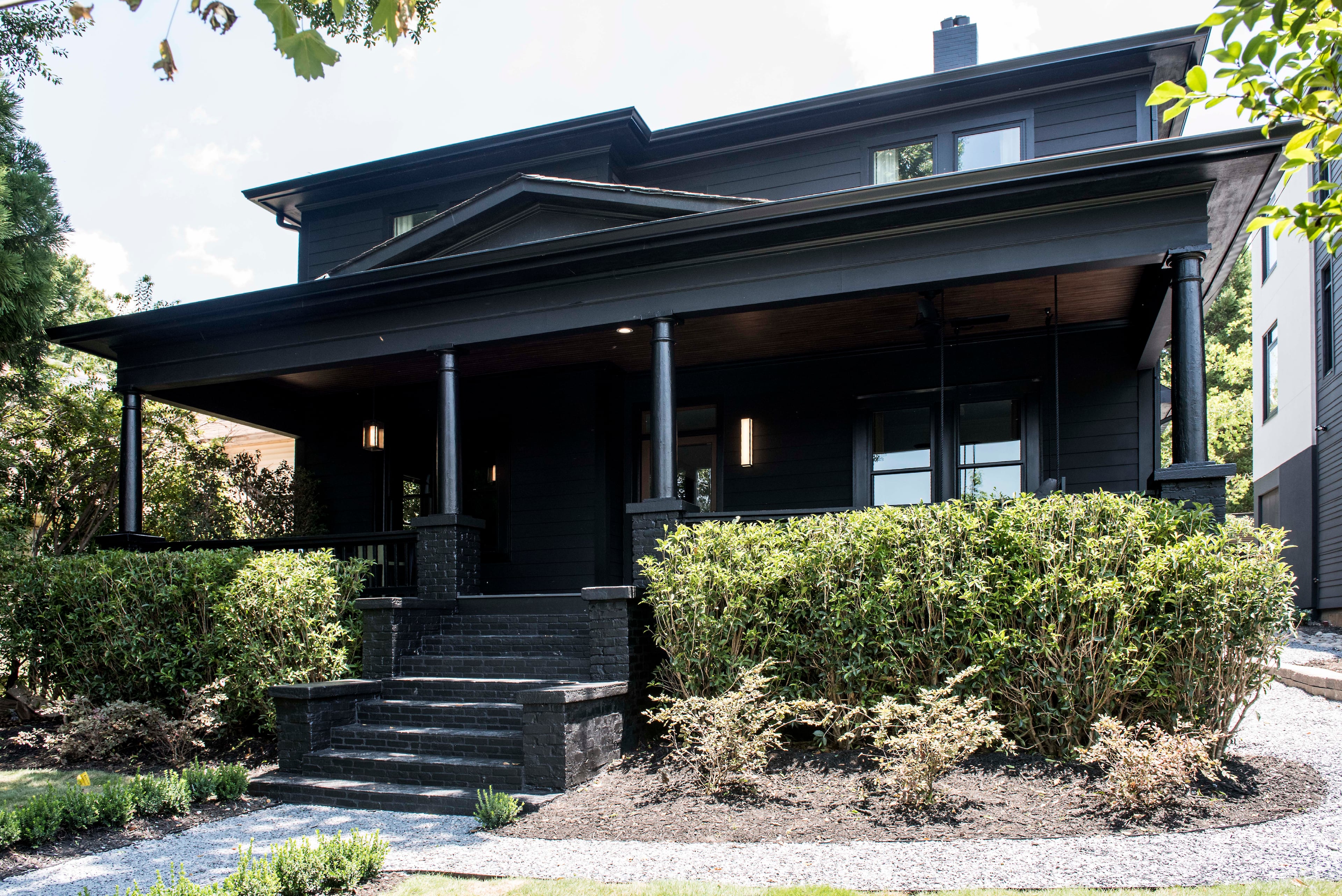 The original exterior of the home was painted all black, from the stairs to the columns and ceilings. Text by Lori Keong/Photo by Dominique White