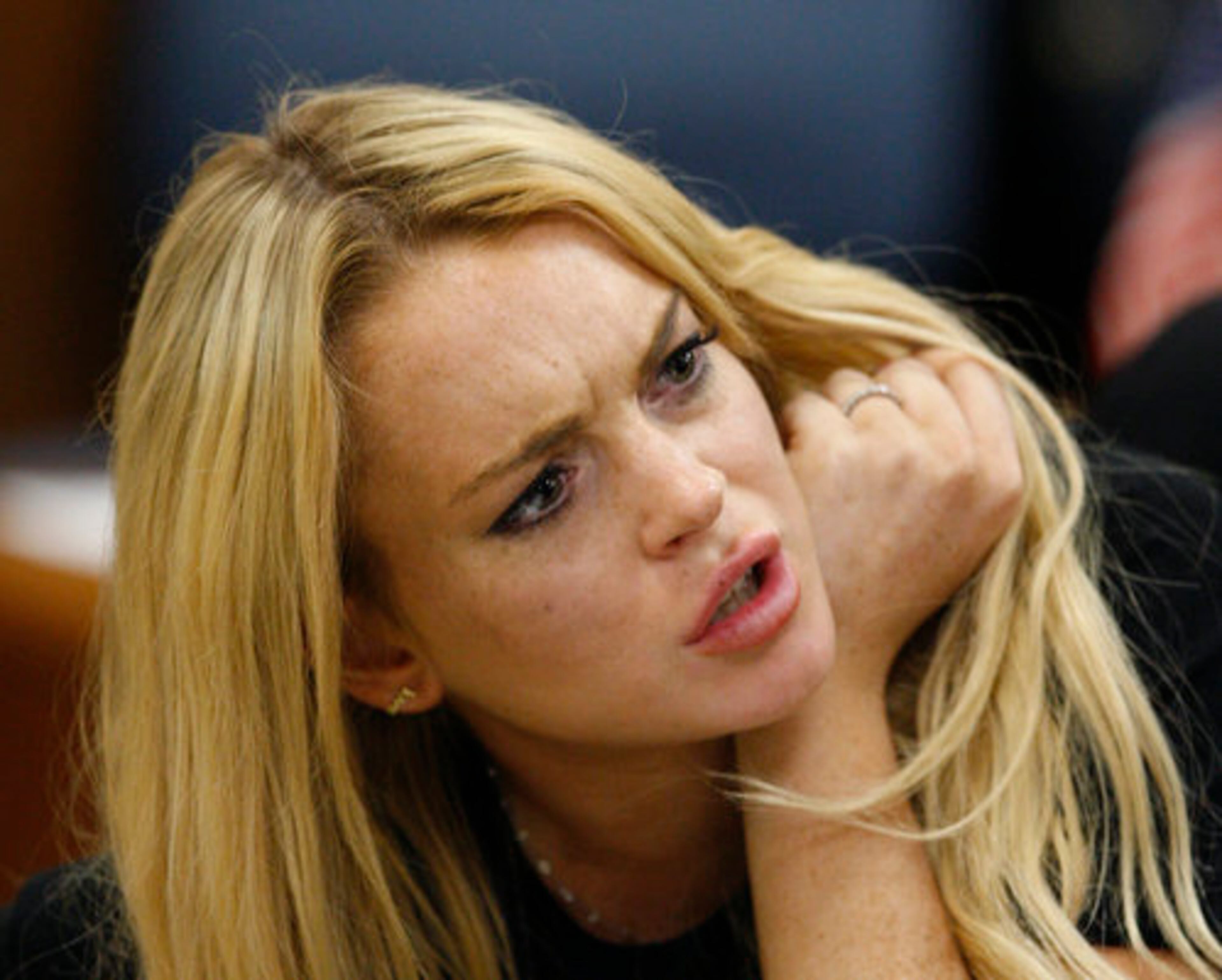 Lindsay Lohan talks to her attorney Shawn Chapman Holley.