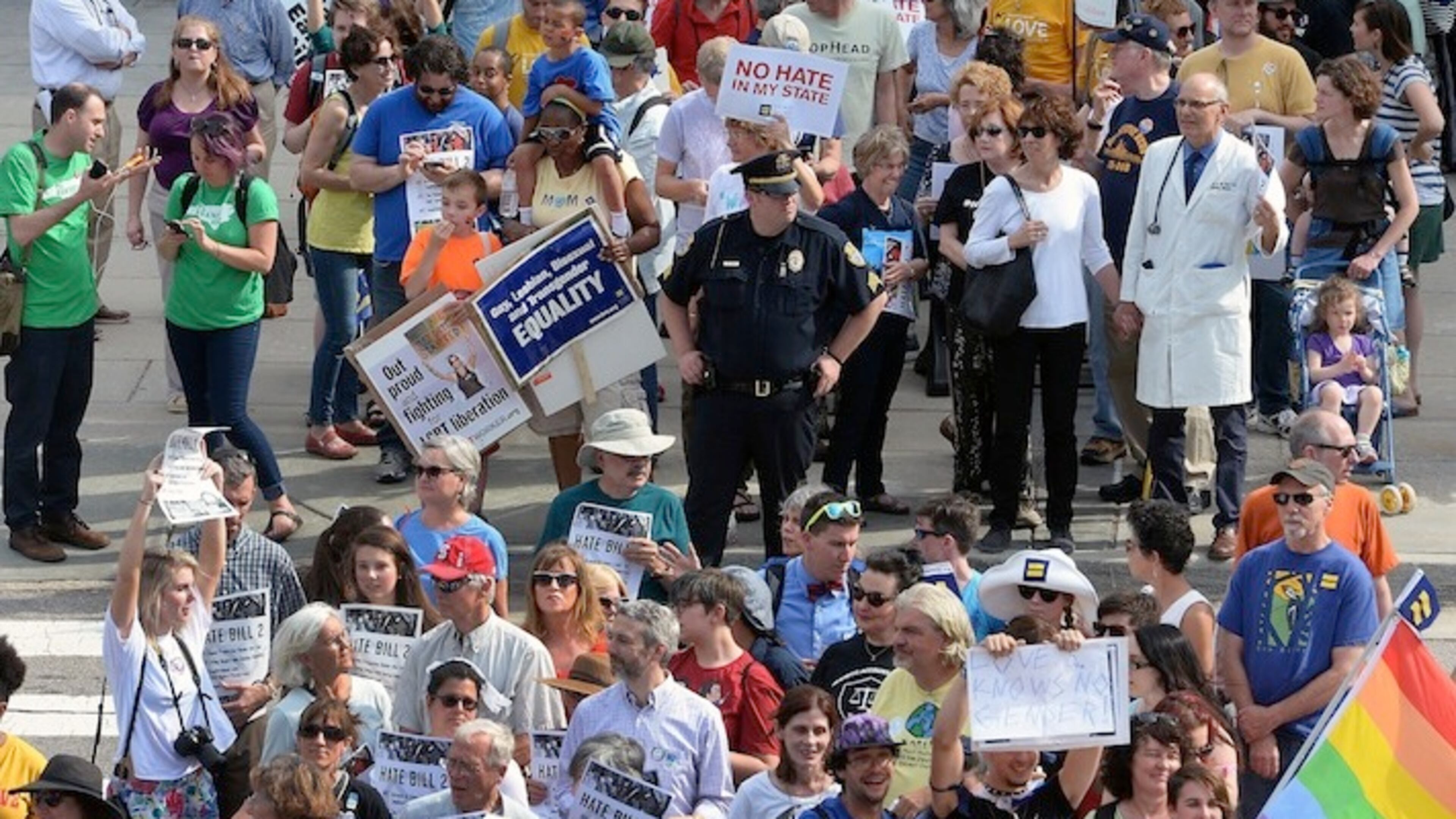 Protesters head into the Legislative building for a sit-in against House Bill 2 in Raleigh, N.C., Monday, April 25, 2016. While demonstrations circled North Carolina's statehouse on Monday, for and against a Republican-backed law curtailing protections for LGBT people and limiting public bathroom access for transgender people, House Democrats filed a repeal bill that stands little chance of passing. (Chuck Liddy/The News & Observer via AP) MANDATORY CREDIT