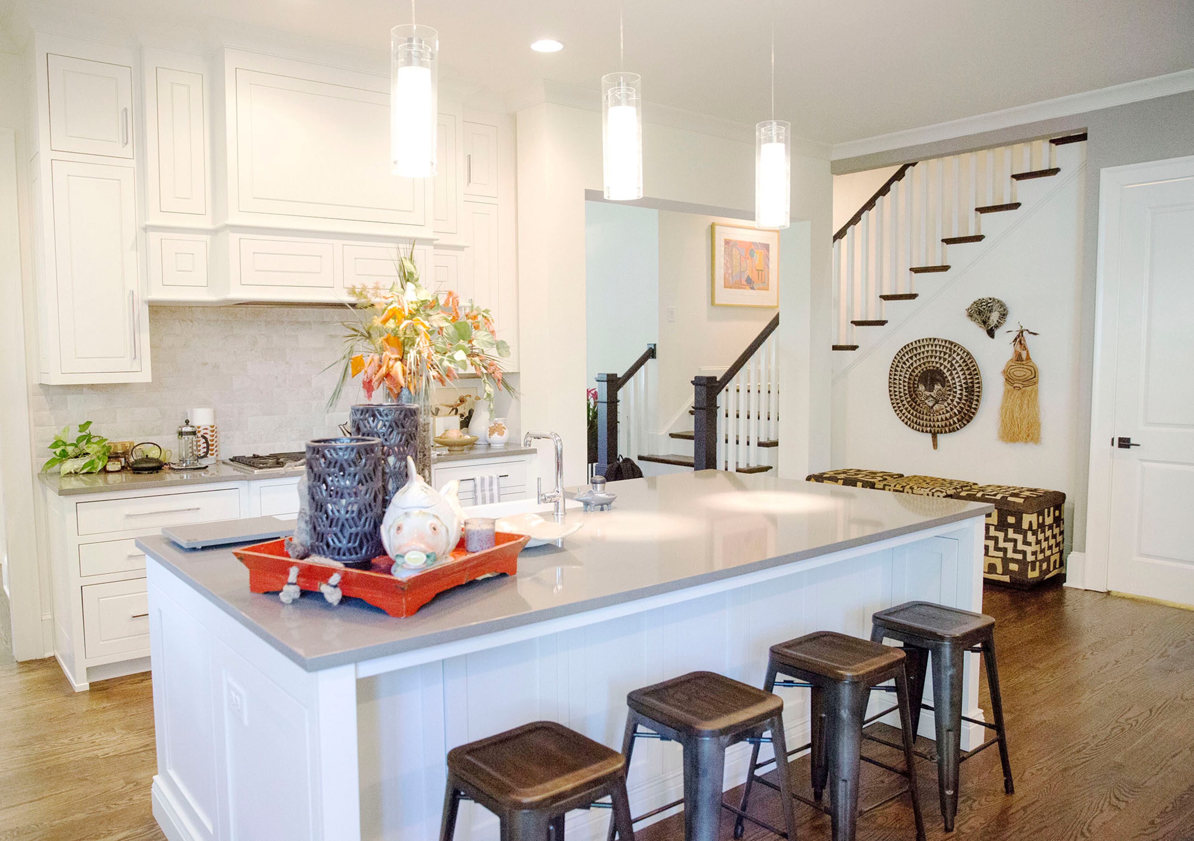 Homeowner Judy Tabb hosts a group studying ancient Greek, who congregate at the island, where she sets up the buffet, and spill into the keeping room.