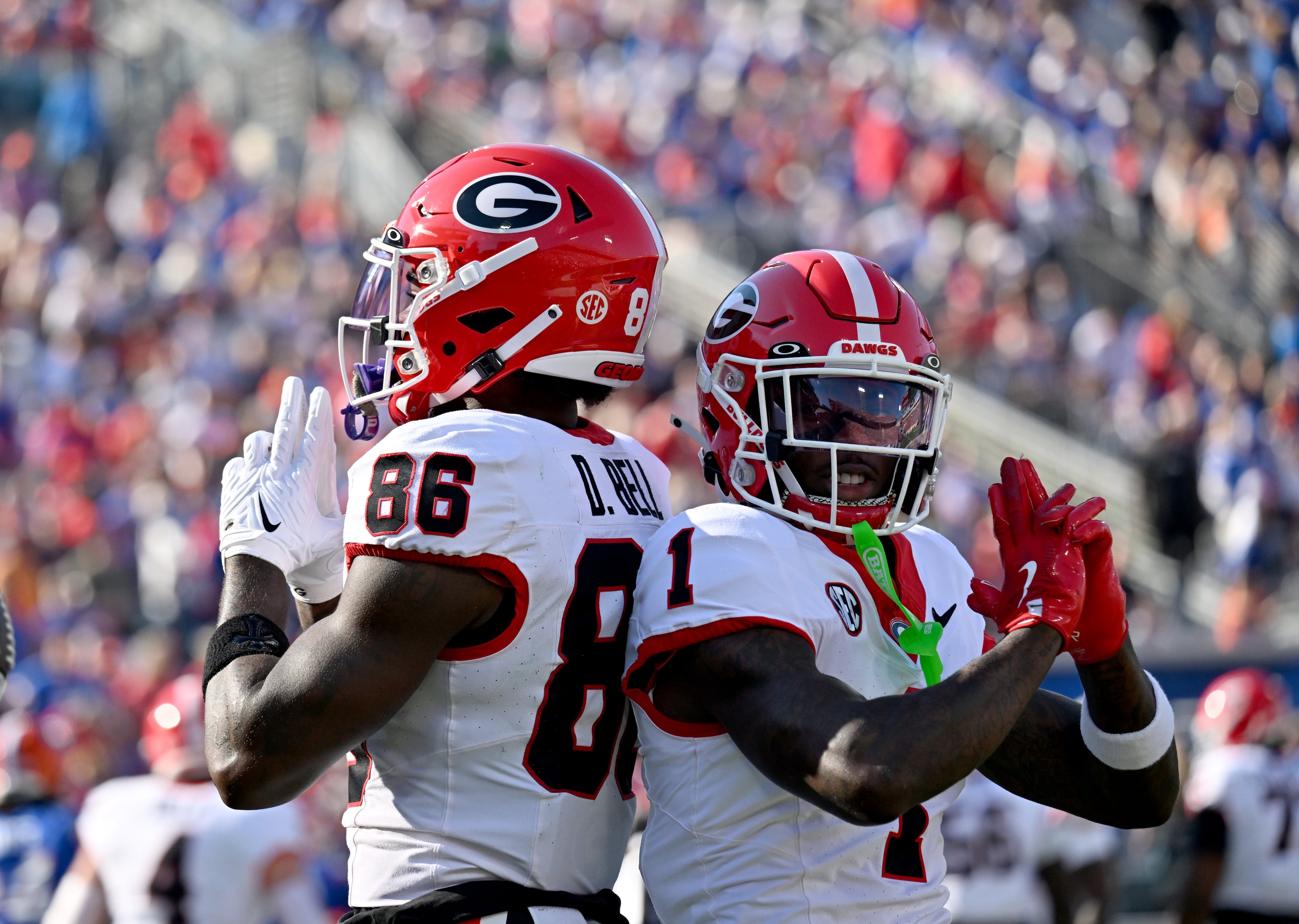 Georgia wide receiver Dillon Bell (86) celebrates with Georgia wide receiver Zachariah Branch (1) after scoring a touchdown during the first half in an NCAA football game, Saturday, November 1, 2025, Jacksonville, Fla. (Hyosub Shin / AJC)
