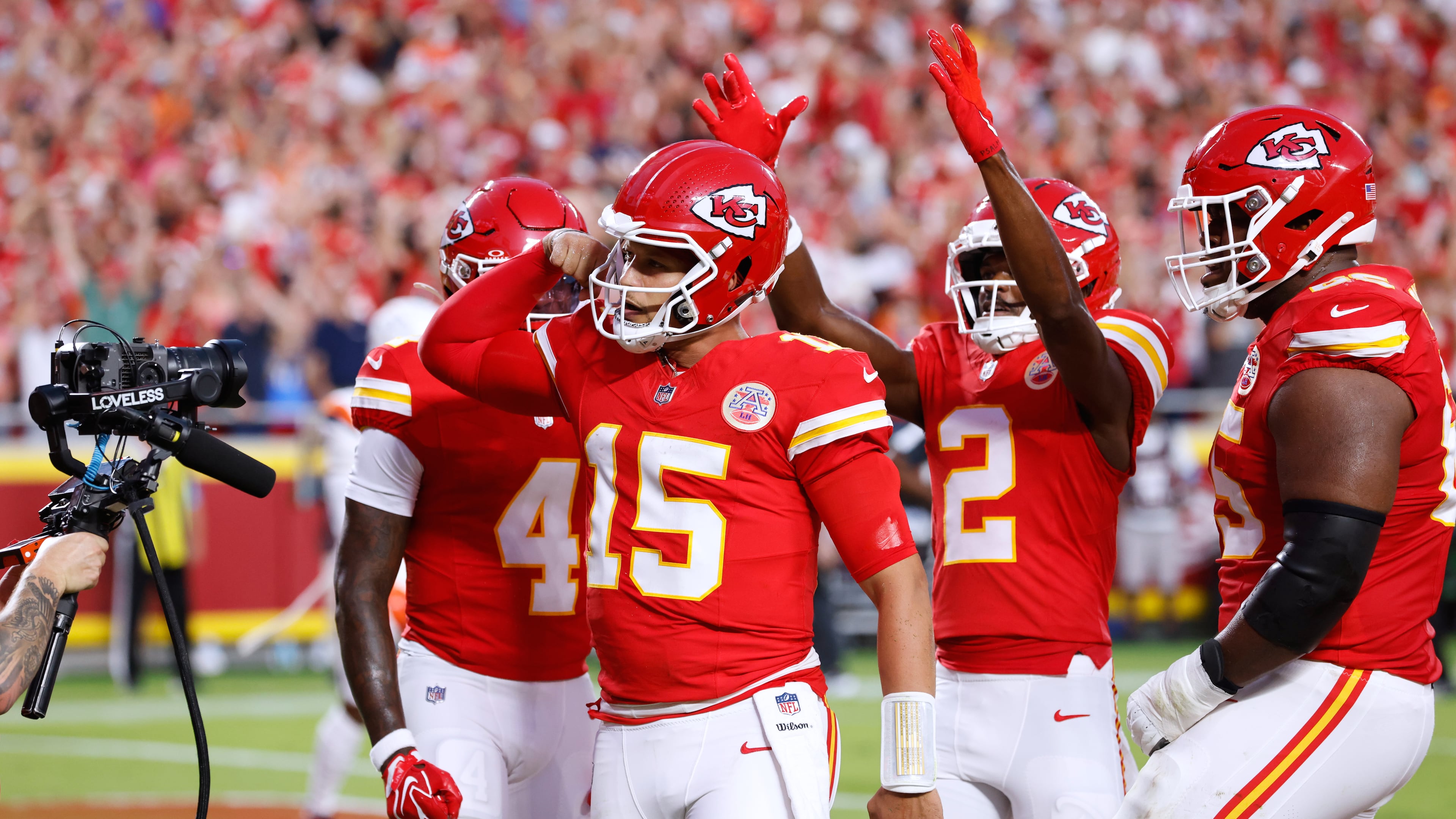 Kansas City Chiefs quarterback Patrick Mahomes (15) celebrates his touchdown run with teammates wide receiver Rashee Rice (4), wide receiver Tyquan Thornton (2) and guard Trey Smith (65) during the first half of an NFL football game against the Denver Broncos, Monday, Sept. 14, 2026, in Kansas City, Mo. (AP Photo/Colin E. Braley)