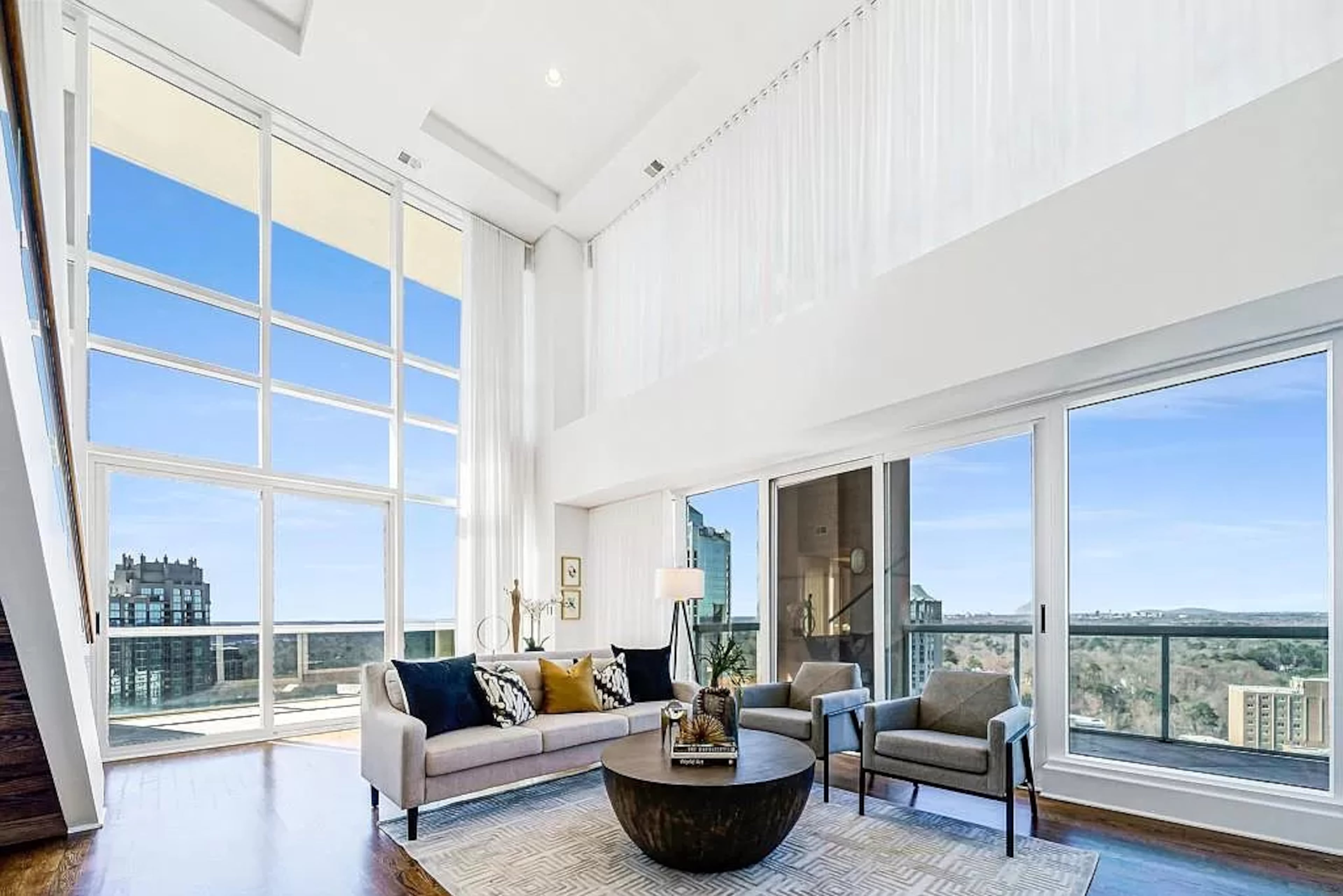 Perched above Buckhead at The Phoenix on Peachtree, this stunning two-story, 2 bedroom and den penthouse dazzles with sprawling views treetop views as well as Midtown, Downtown and Buckhead skylines.