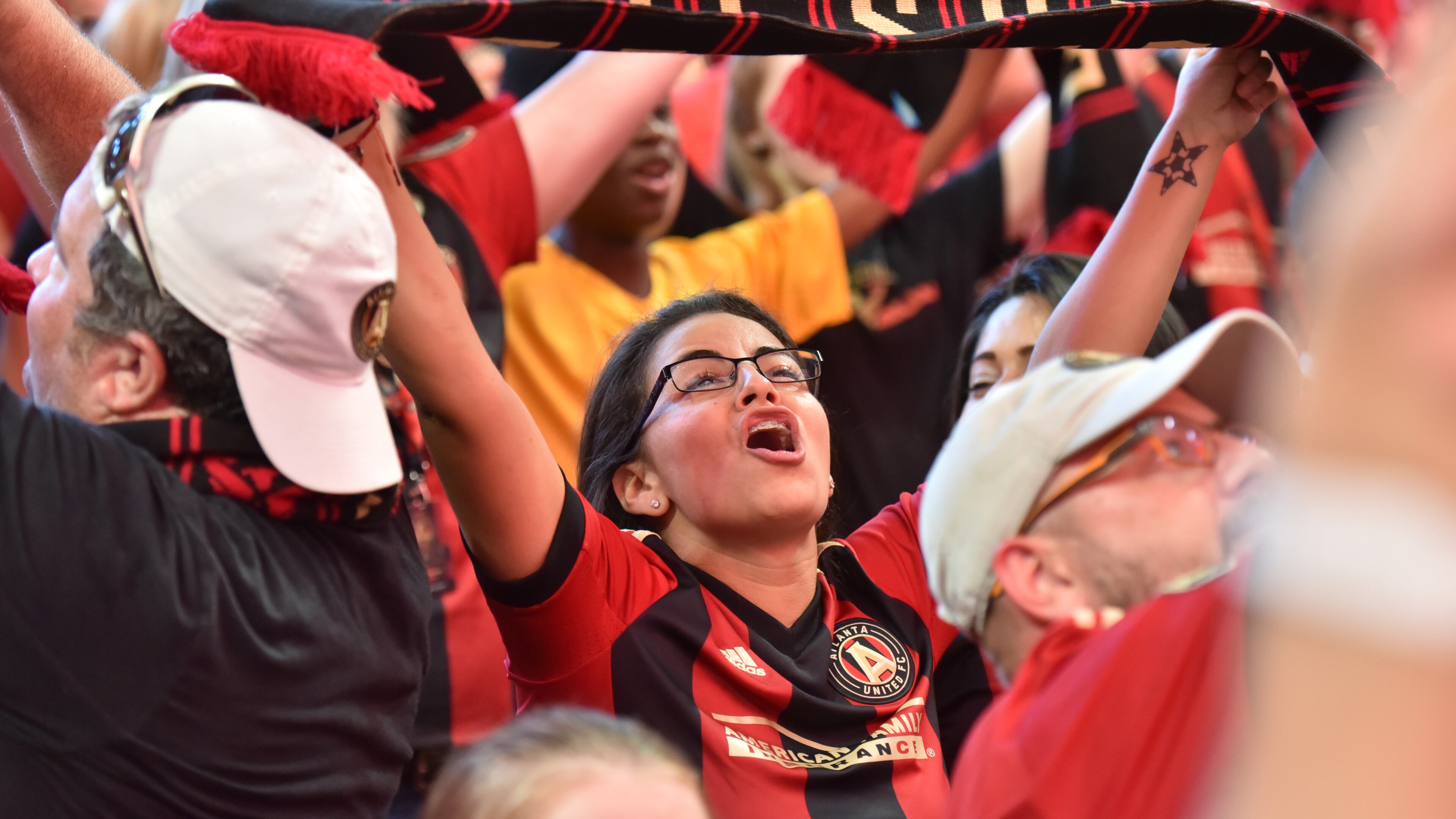 September 16, 2017 Atlanta - Atlanta United fans cheer before an MLS soccer match at Mercedes-Benz Stadium on Saturday, September 16, 2017. Saturdayâs Atlanta United match against Orlando City will be the third at Mercedes-Benz for the first-year franchise, and a new Major League Soccer single-game attendance record is expected to be set in the latest meeting of the southern MLS rivals. HYOSUB SHIN / HSHIN@AJC.COM