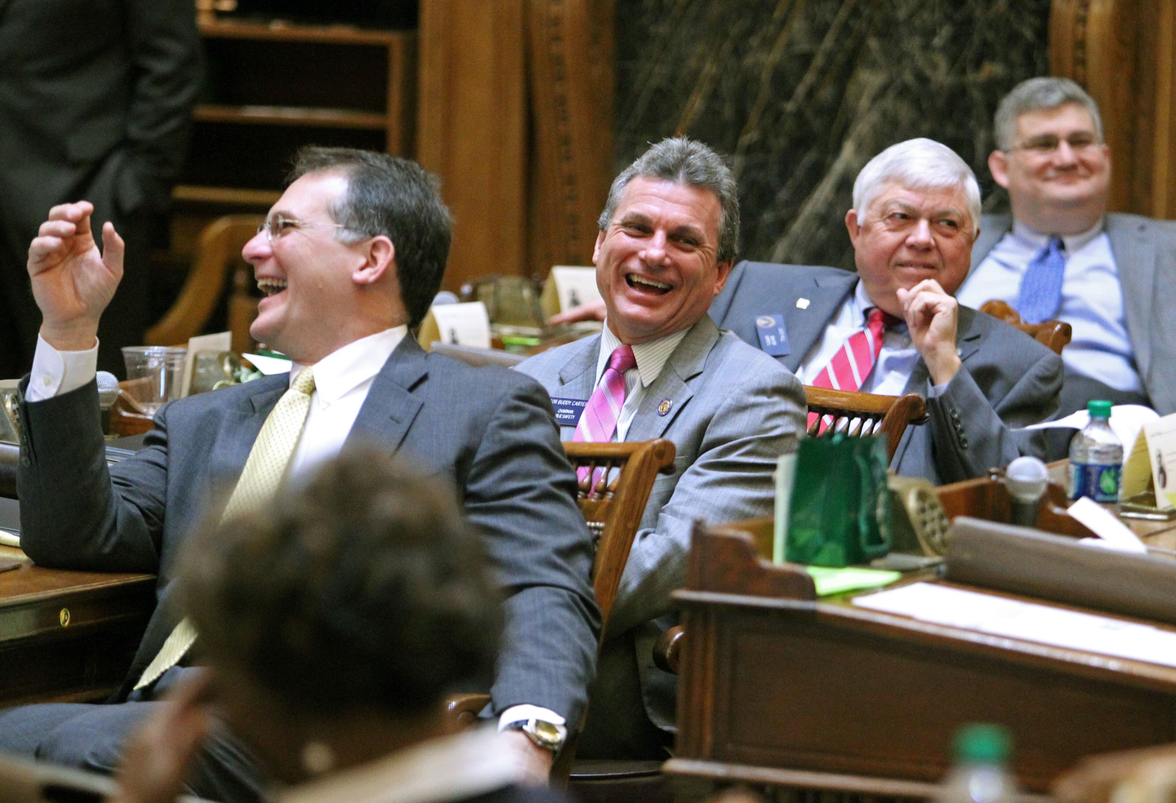 Sen. William Ligon, R-Brunswick, left, Sen. Buddy Carter, R-Pooler, center, and Sen. Jack Hill, R-Reidsville, react as freshman Sen. Tyler Harper, R-Ocilla, (not pictured) gets "hazed" as he introduces his first bill, Senate Bill 91, Wednesday, Feb. 13. Every time a freshman senator sponsors their first bill fellow senators "haze" them in the Senate Chambers as a sort of rite of passage.
