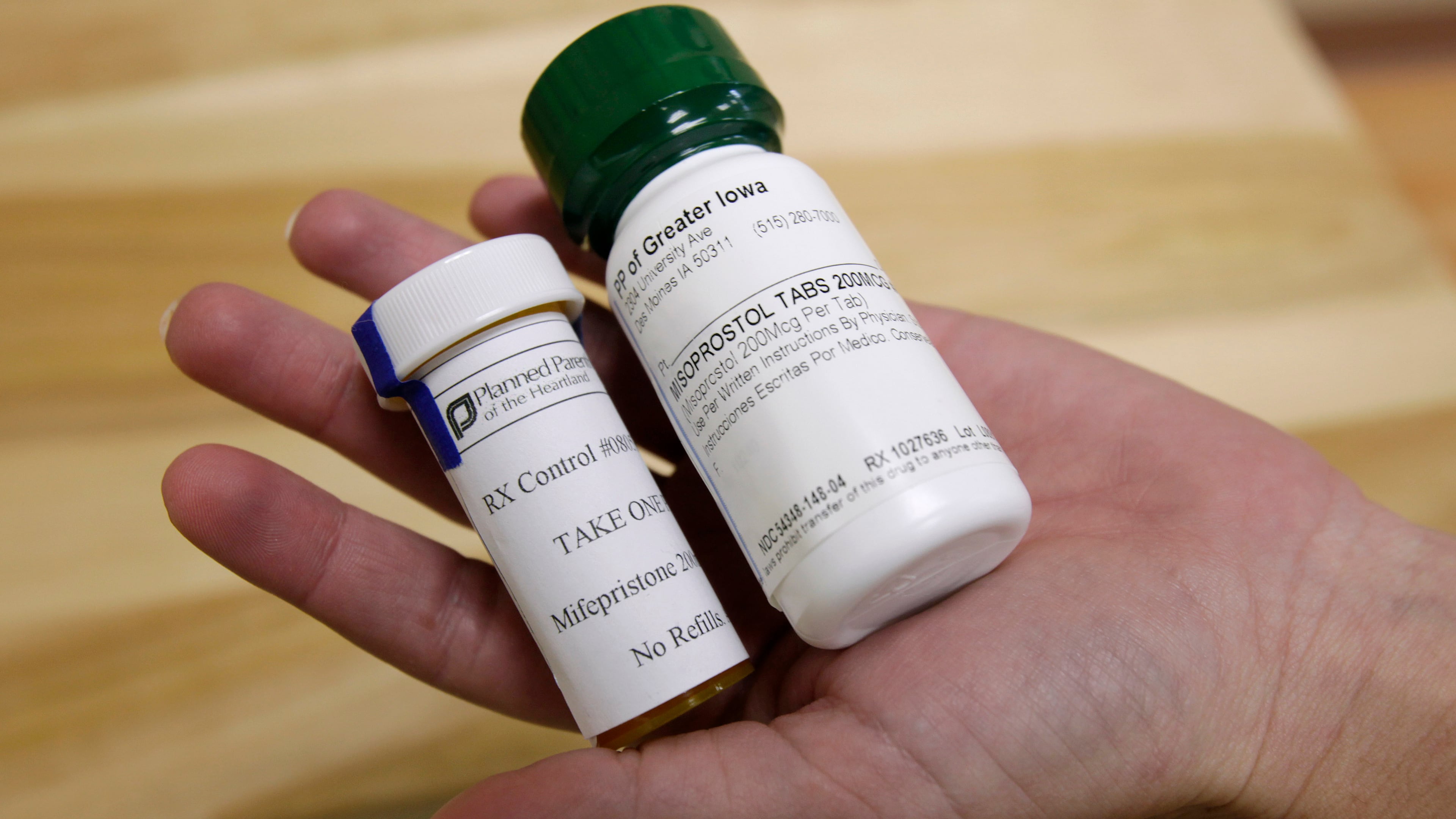 FILE - Bottles of abortion pills mifepristone, left, and misoprostol, right, are displayed at a clinic in Des Moines, Iowa, Sept. 22, 2010. (AP Photo/Charlie Neibergall, File)