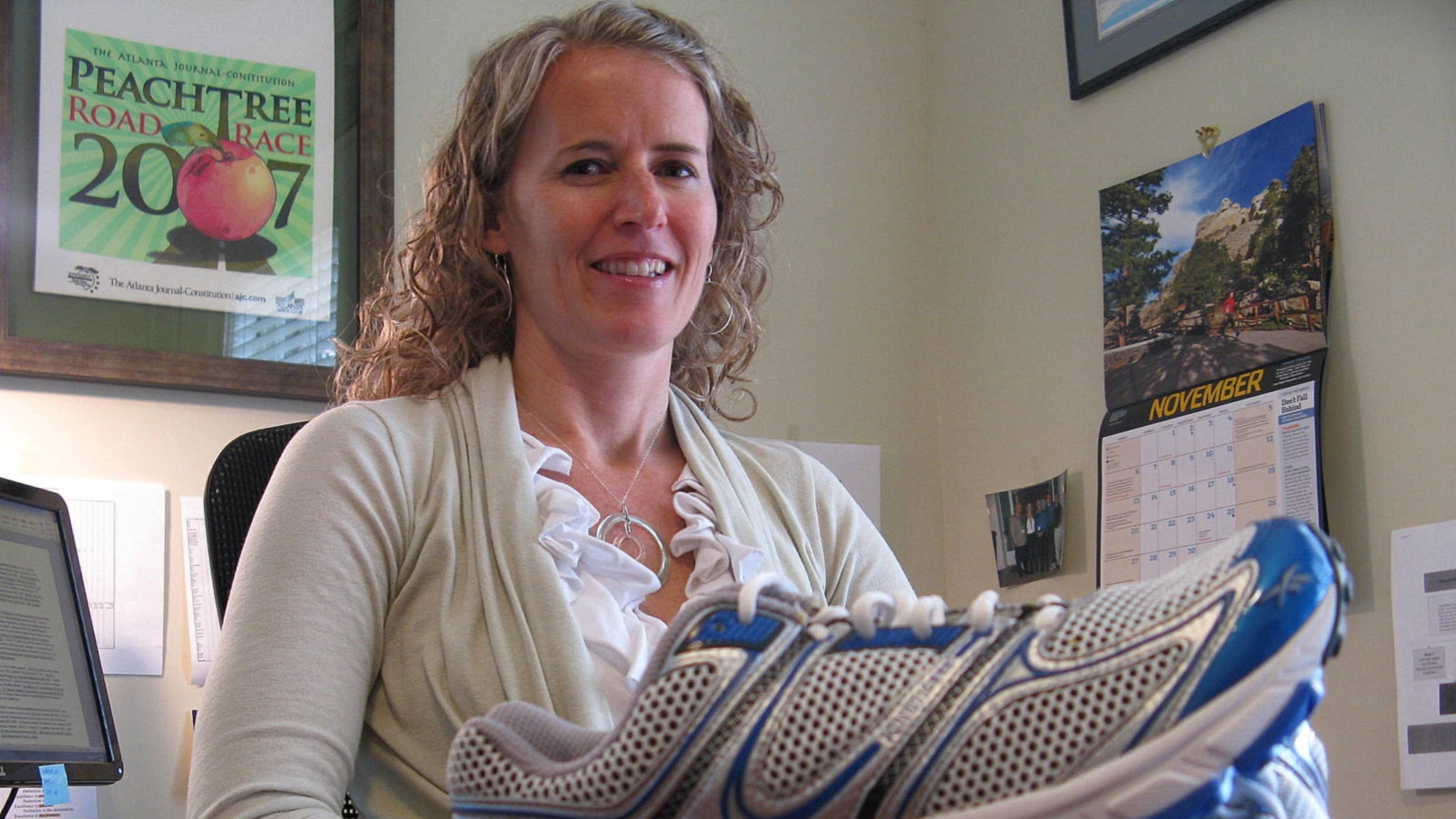 Tracey Russell, seen in this Nov. 16, 2011, photo, will remain with the Atlanta Track Club through the 2013 AJC Peachtree Road Race, which will be held on its traditional Fourth of July date.