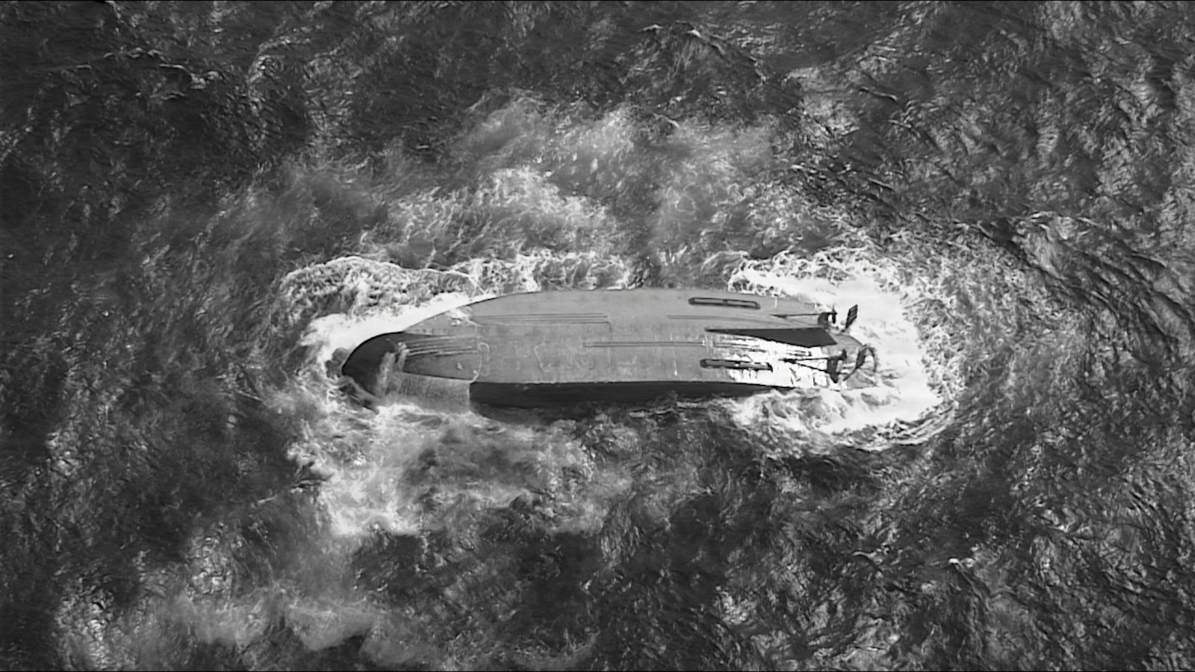 A U.S. Coast Guard HC-130 Hercules airplane crew assigned to Coast Guard Air Station Barbers Point flies over an overturned vessel offshore Saipan, Saturday, April 18, 2026, while searching for a missing vessel, the Mariana, that experienced an engine failure April 15. (U.S. Coast Guard/Air Station Barbers Point via AP)