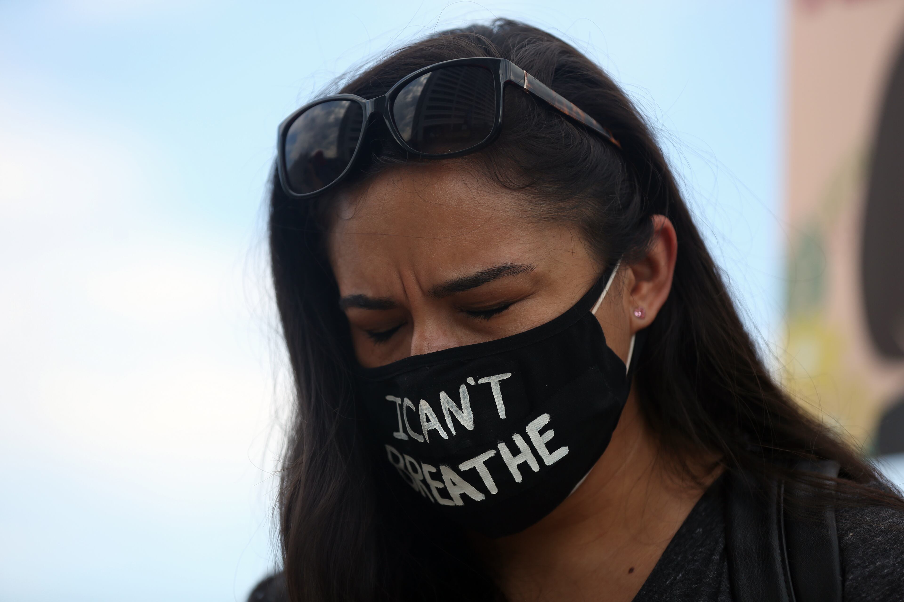 Tara Winston pauses for a moment of silence as protesters gather at the Richard B. Russell Federal Building in downtown Atlanta for March on Georgia, a protest hosted by the Georgia chapter for the NAACP, on Monday, June 15, 2020. (REBECCA WRIGHT FOR THE ATLANTA JOURNAL-CONSTITUTION)