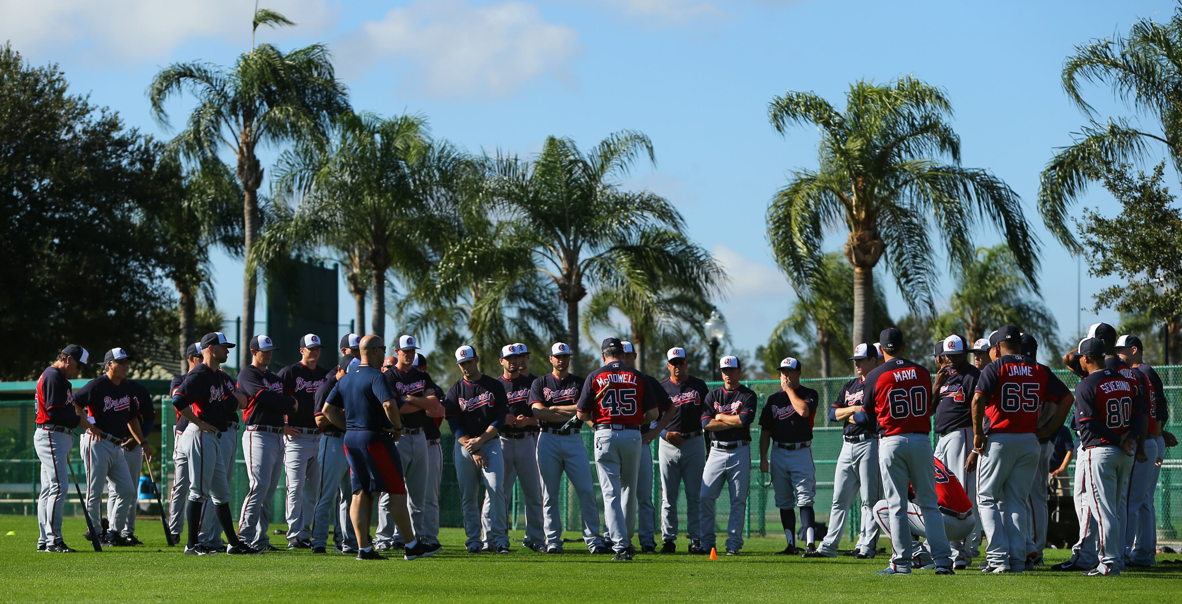 Braves pitching coach (45) Roger McDowell (center) has plenty of weapons to work with as he gathers his platoon for instructions to begin their days work at spring training on Thursday, Feb. 20, 2014, in Lake Buena Vista, FL.