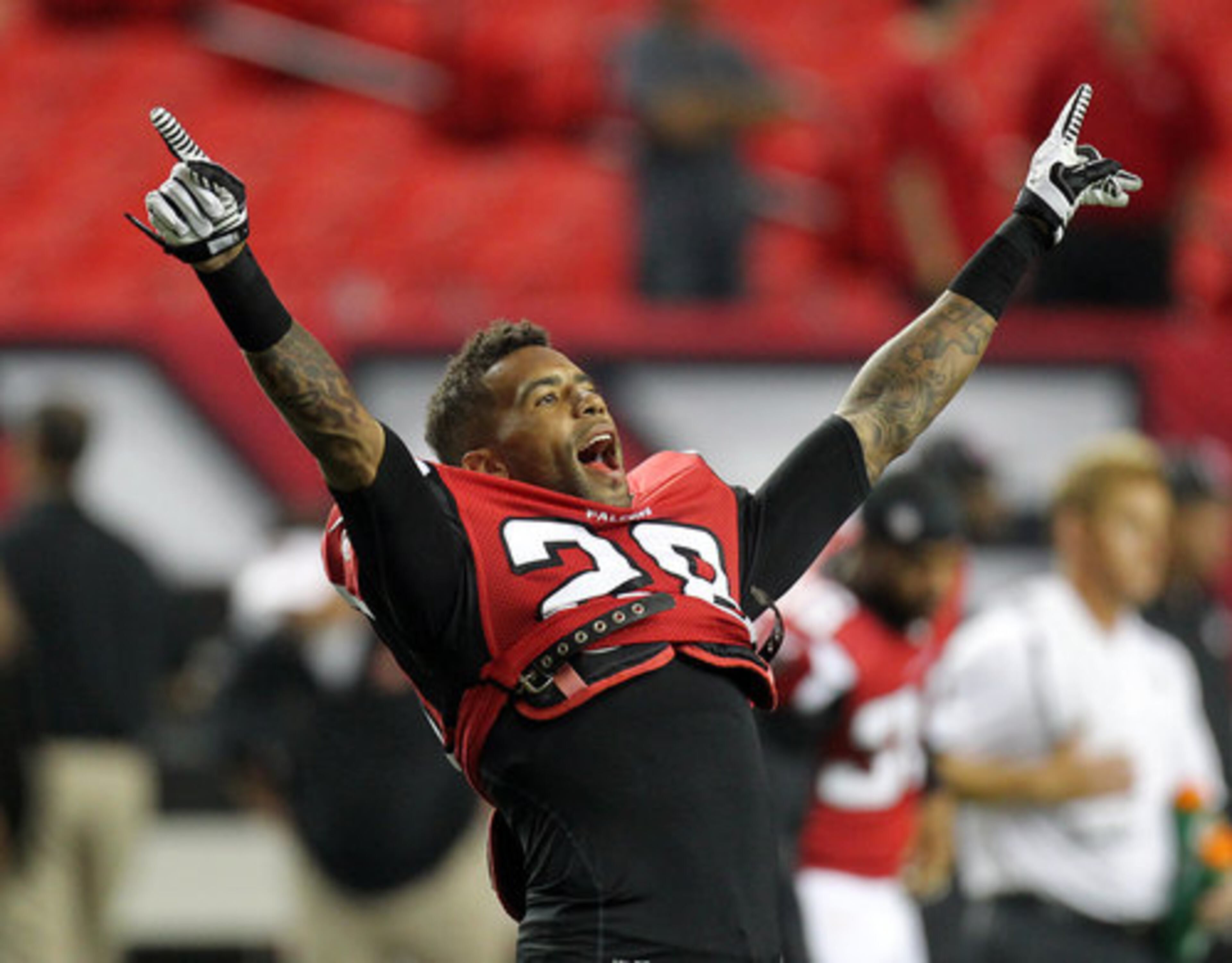 Falcons safety Thomas DeCoud fires up the fans and his teammates during pregame warmups for the Cincinnati Bengals at the Georgia Dome in Atlanta on Thursday, August 16, 2012.