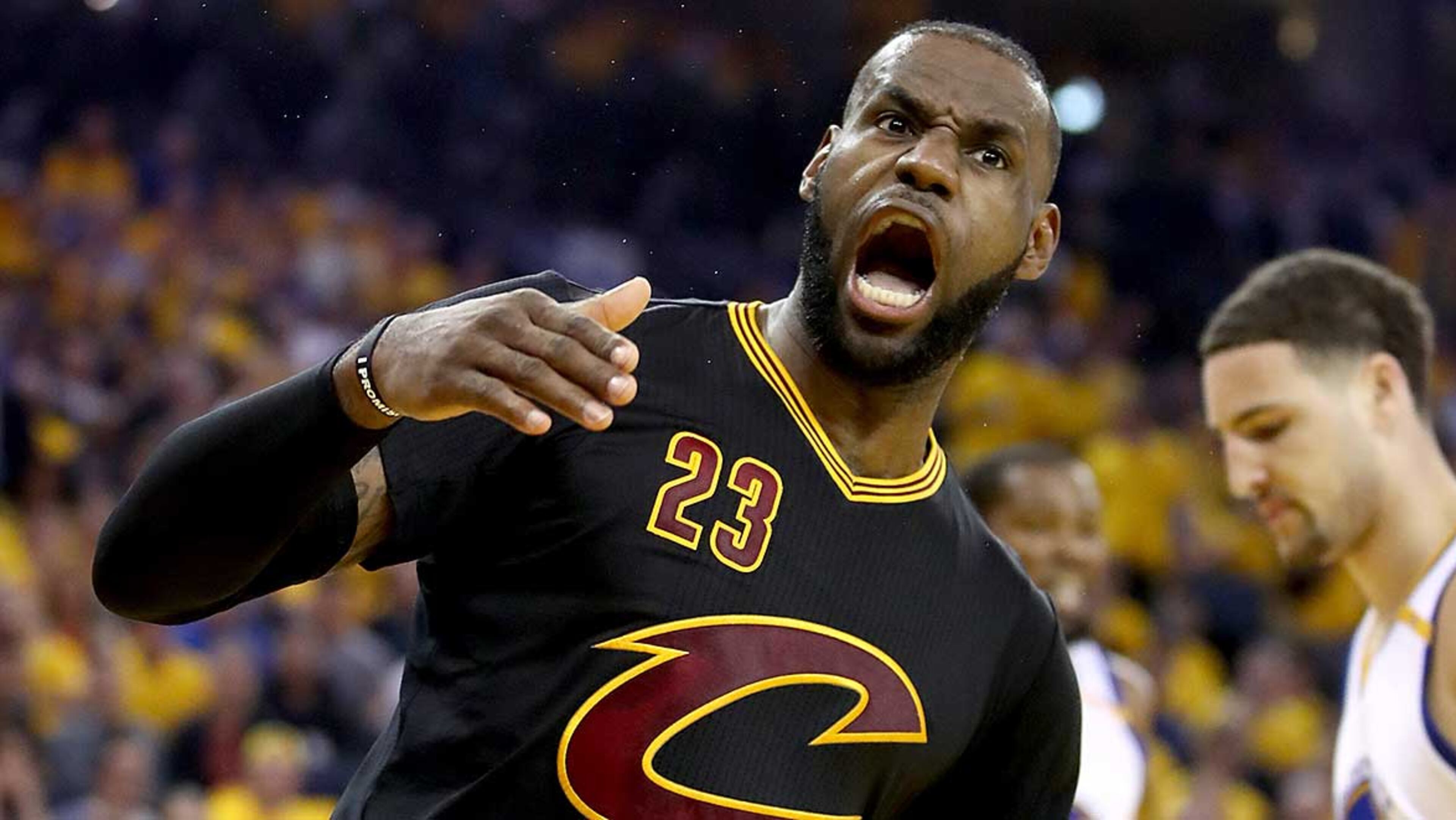 LeBron James reacts after a dunk Monday in Game 5 of the NBA Finals against the Warriors.