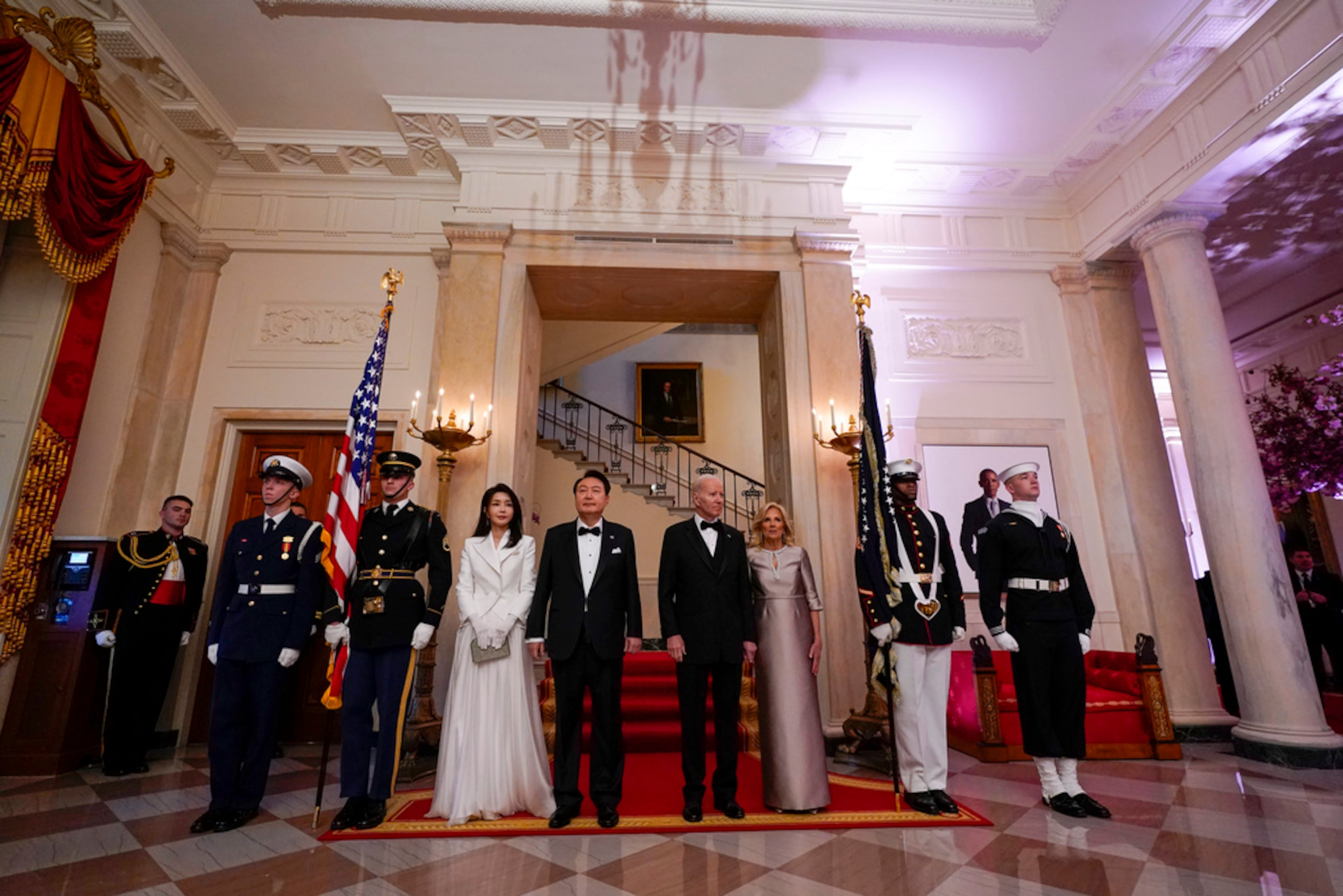 South Korea's President Yoon Suk Yeol and his wife Kim Keon Hee and President Joe Biden and first lady Jill Biden arrive for a photo in front of the Grand Staircase during a State Dinner at the White House in Washington, Wednesday, April 26, 2023. (AP Photo/Susan Walsh)