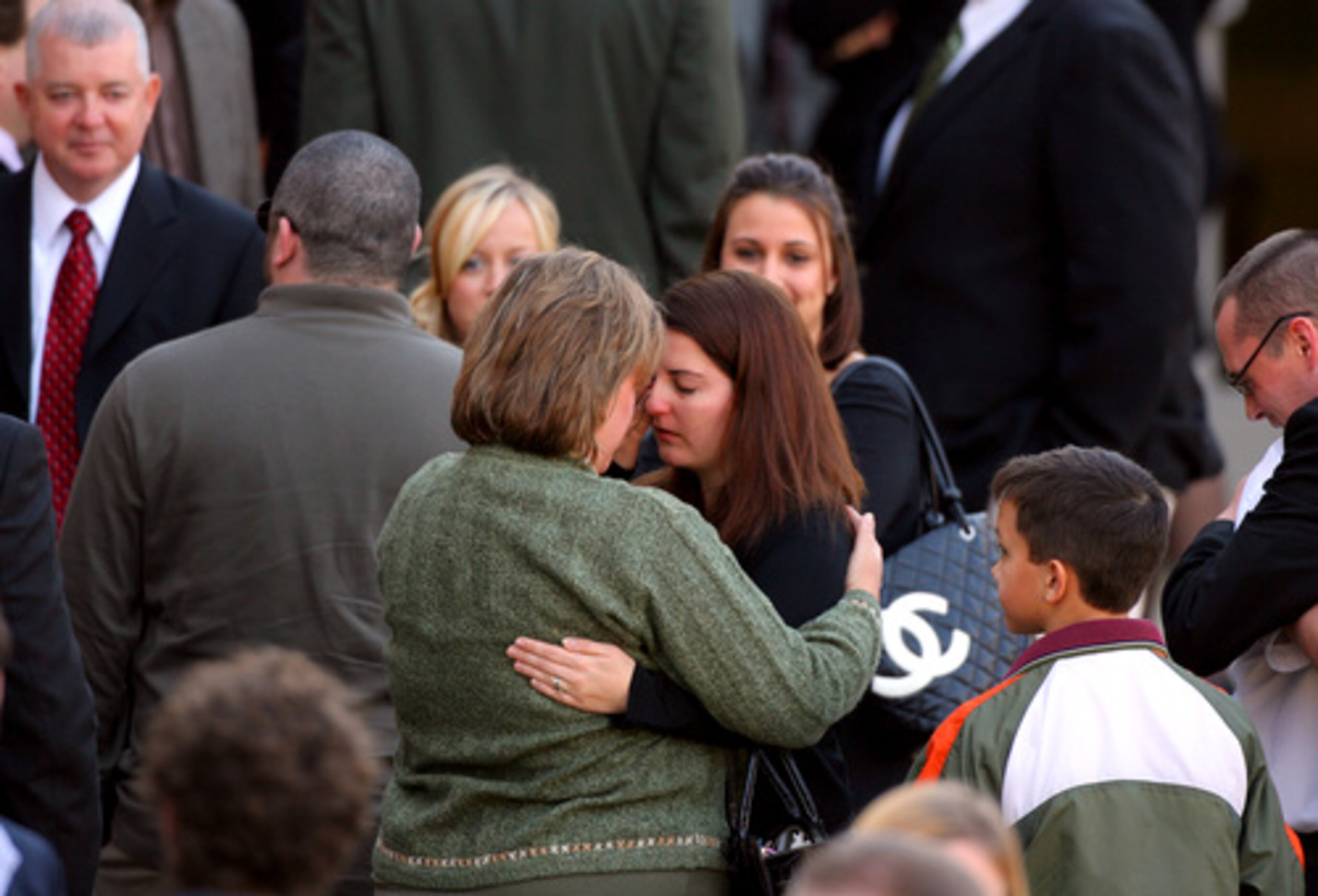 Friends and family members outside the church after the service. Three of Emerson's friends and one cousin, Jason Emerson, spoke during the hour-long tribute.