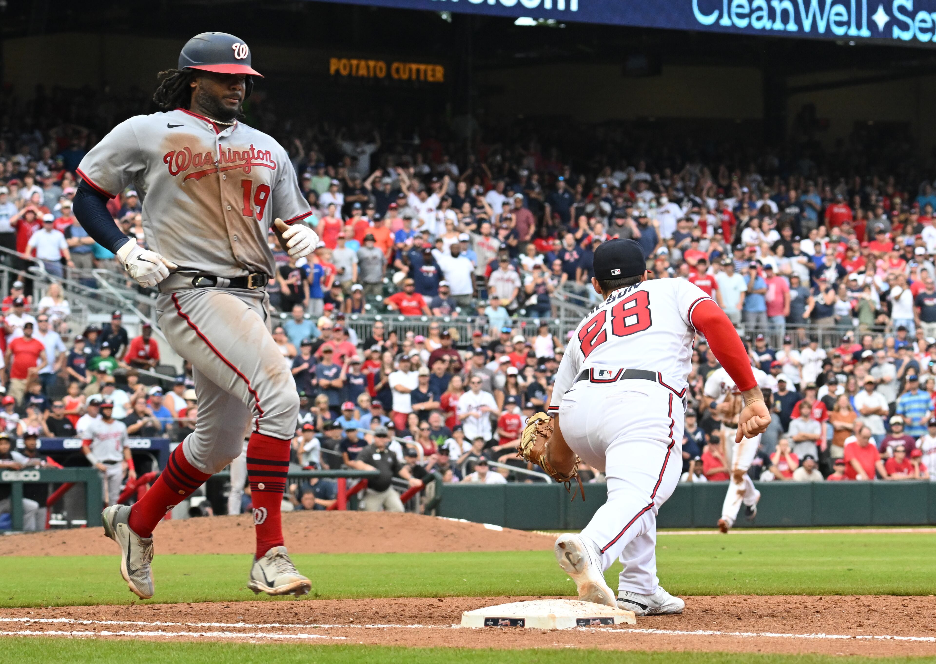Washington Nationals' first baseman Josh Bell (19) is out by Atlanta Braves' first baseman Matt Olson (28) to end the 9th inning at Truist Park on Saturday, July 9, 2022. Atlanta Braves won 4-3 over Washington Nationals. (Hyosub Shin / Hyosub.Shin@ajc.com)