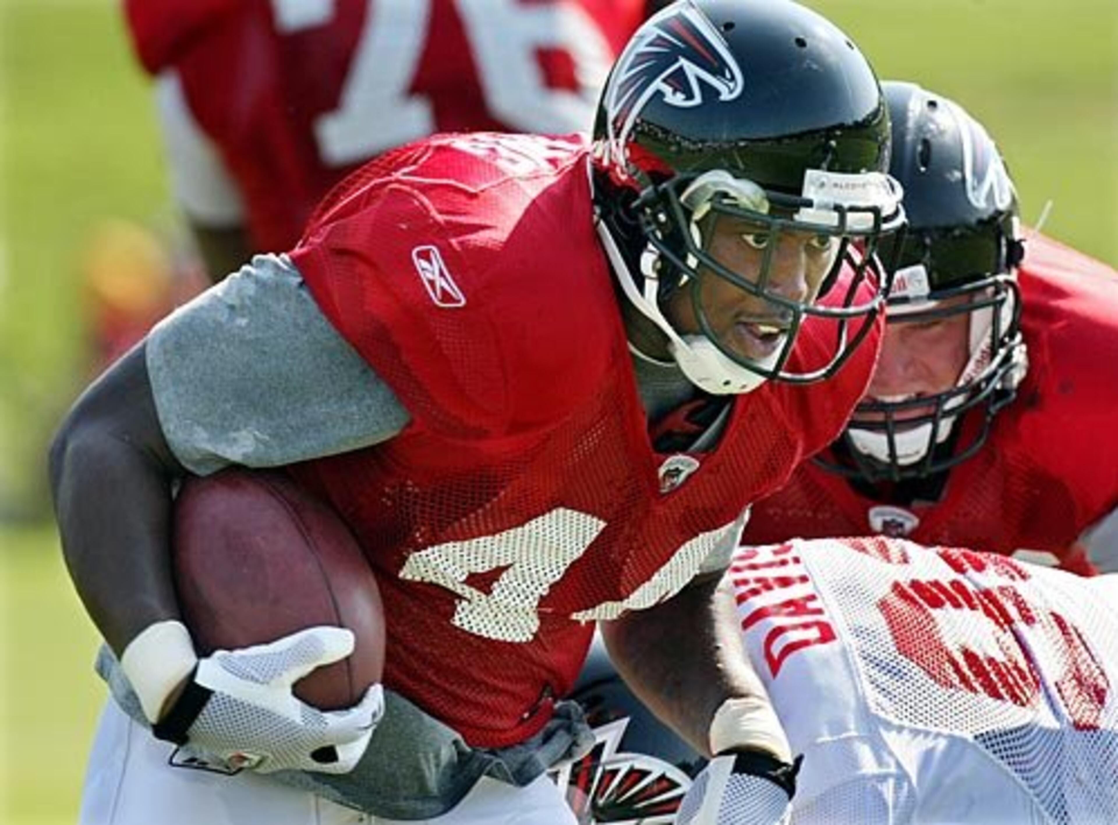 Running back Jason Snelling (44) hits the hole for some yards.