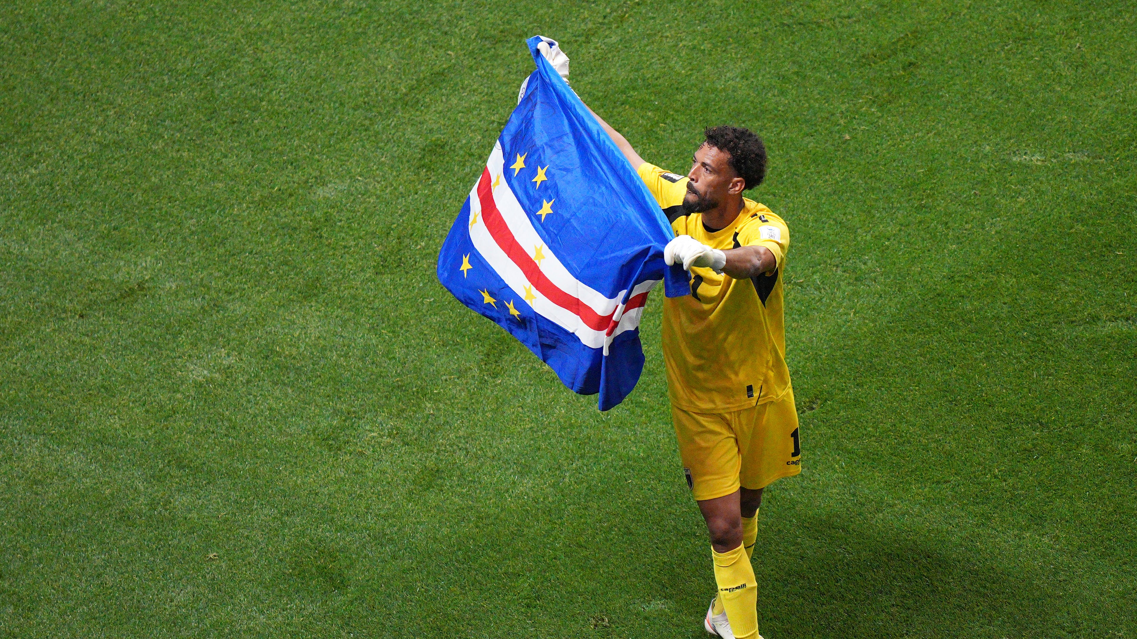 Cape Verde goalkeeper Vozinha (1) waves a flag for fans after a 0-0 draw during the World Cup Group H soccer match between Spain and Cape Verde in Atlanta, Monday, June 15, 2026. (AP Photo/Jacob Kupferman)