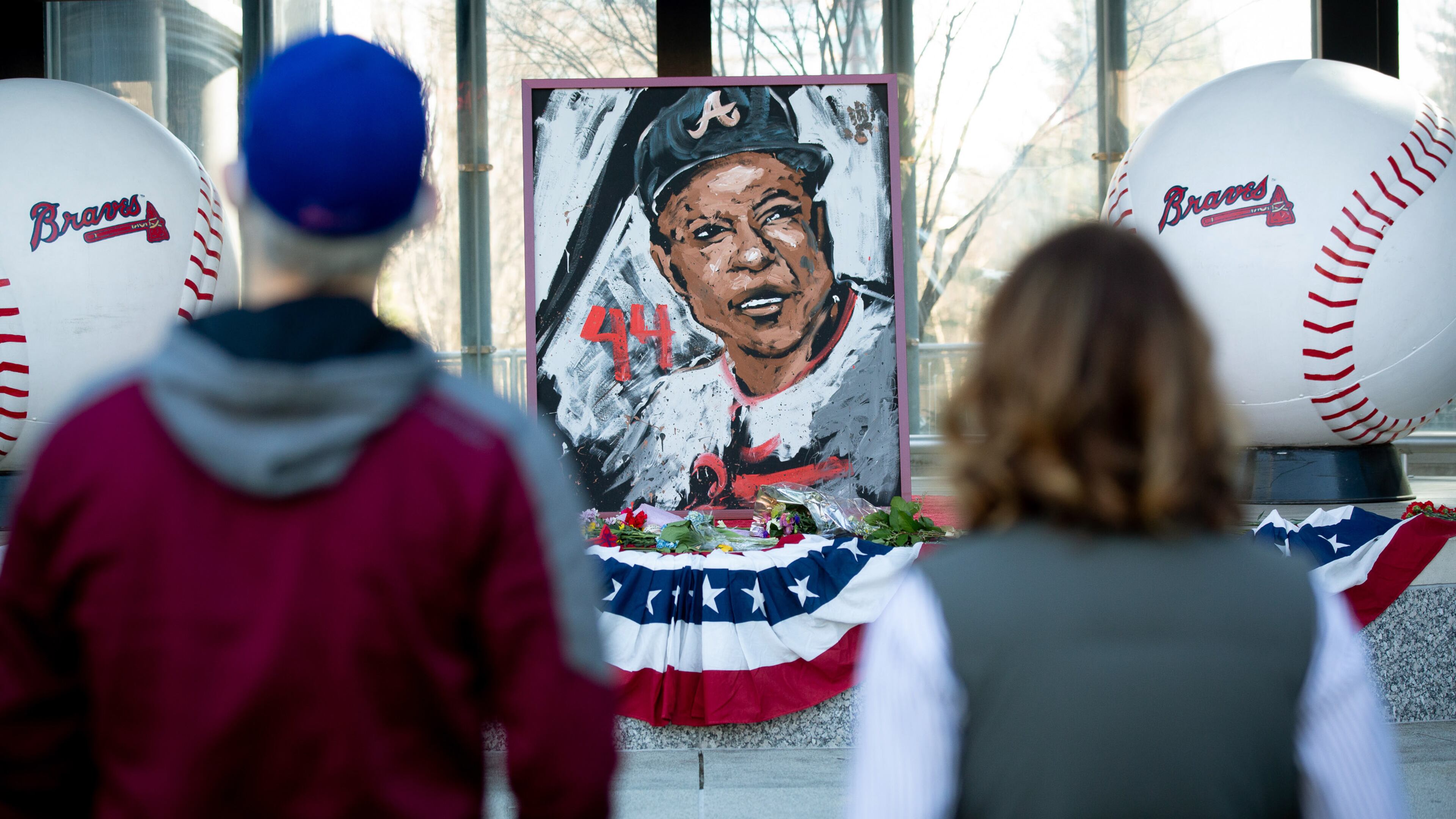People look over the Hank Aaron memorial at Truist Park on Saturday, January 23, 2021, a day after the Braves legend died. (Photo: Steve Schaefer for The Atlanta Journal-Constitution)