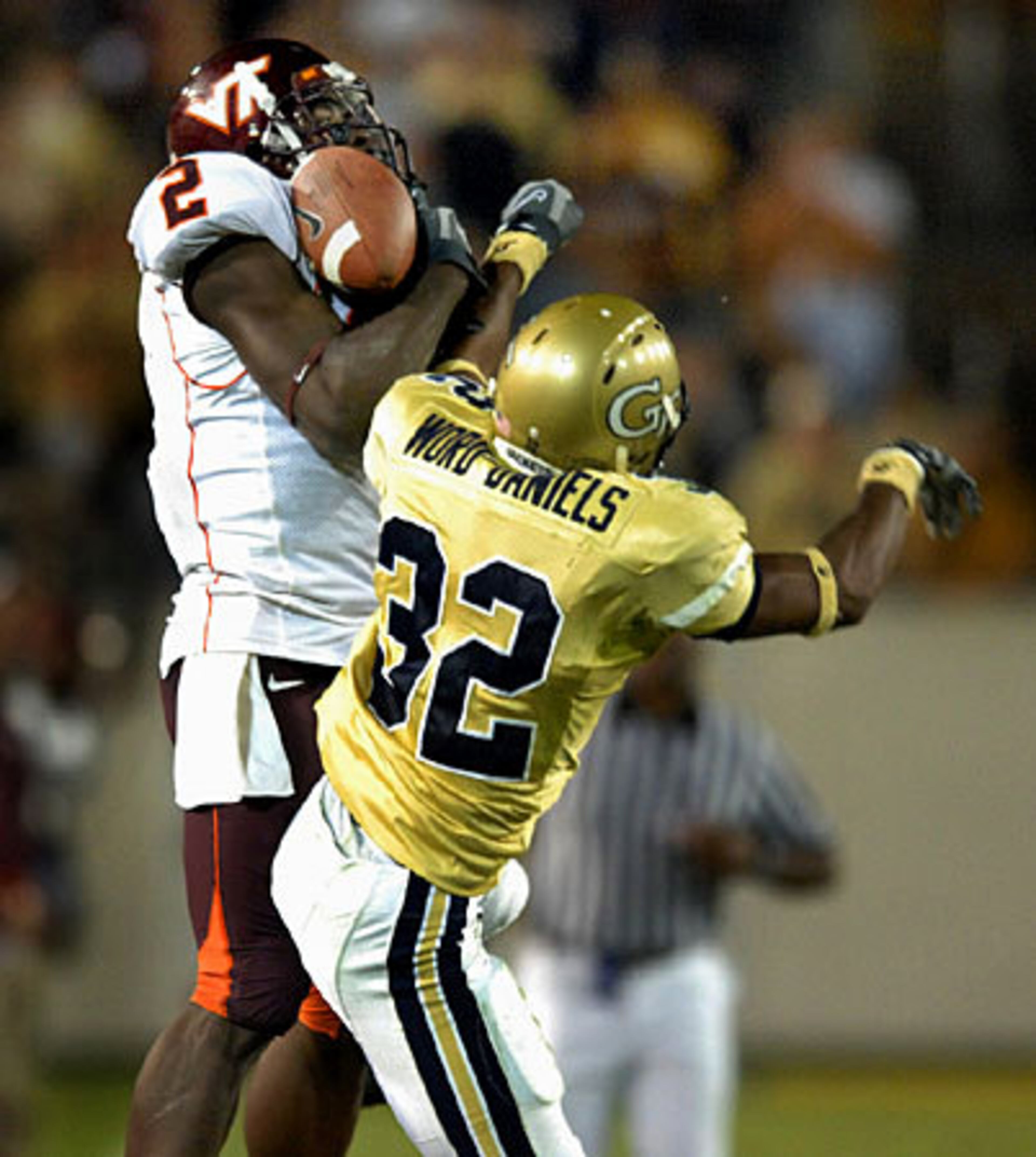 Virginia Tech split end Josh Morgan (2) makes a catch over Georgia Tech cornerback Jahi Word-Daniels (32) in the third period, which resulted in a 71-yard touchdown.