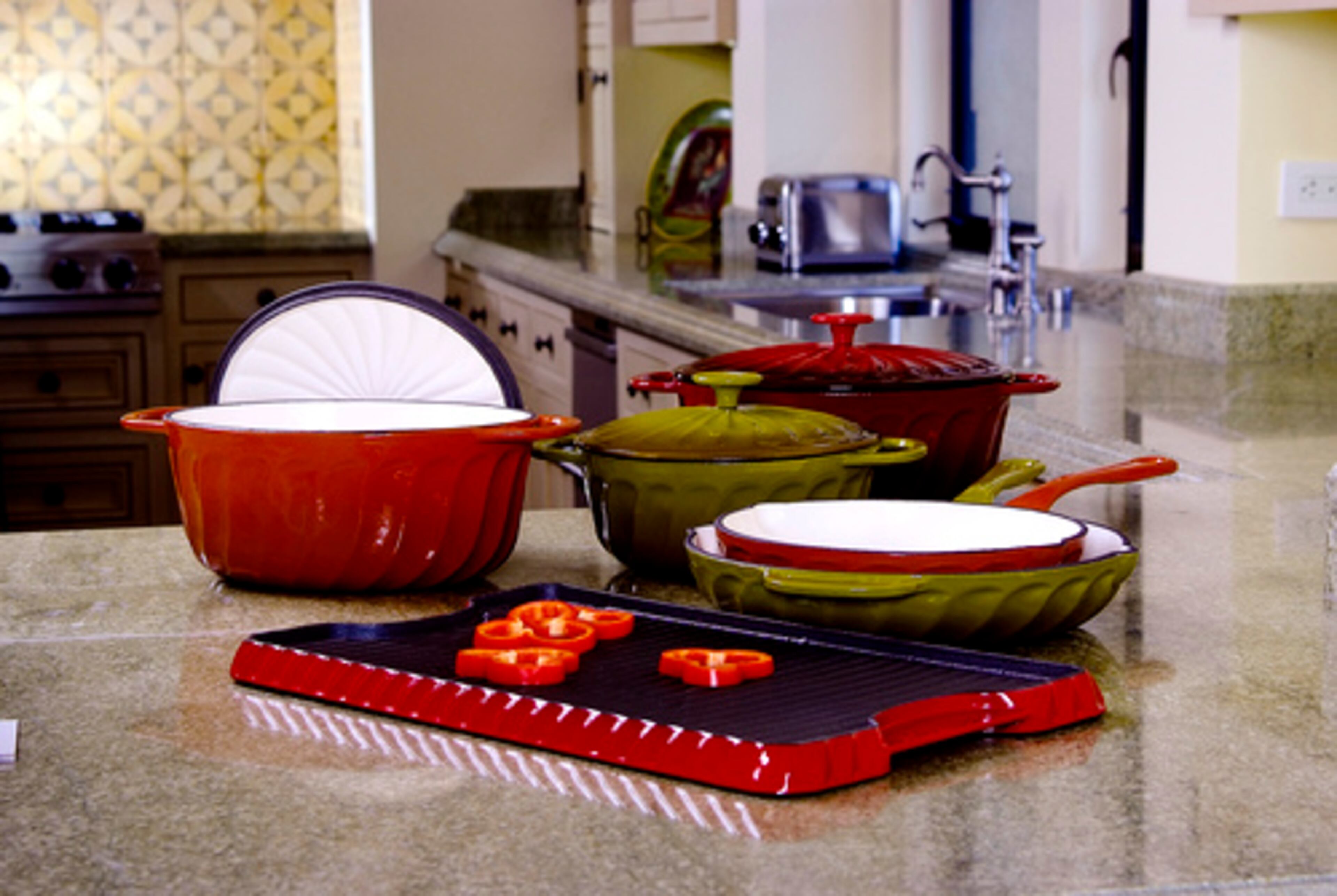COOK WITH PAULA: Meyer Corp. (meyer.com) unveiled the Paula Deen Signature Collection of cookware, tools and cutlery that is almost as expansive as Deen's Southern drawl. Favorite items included the swirled cast-iron pans (from $30 for a 10-inch skillet); the pretty yet sturdy speckled enamel-on-steel mixing bowls ($20 for set of three), and an old-fashioned 8-cup percolator ($25). The 85-plus piece collection will appear in September.