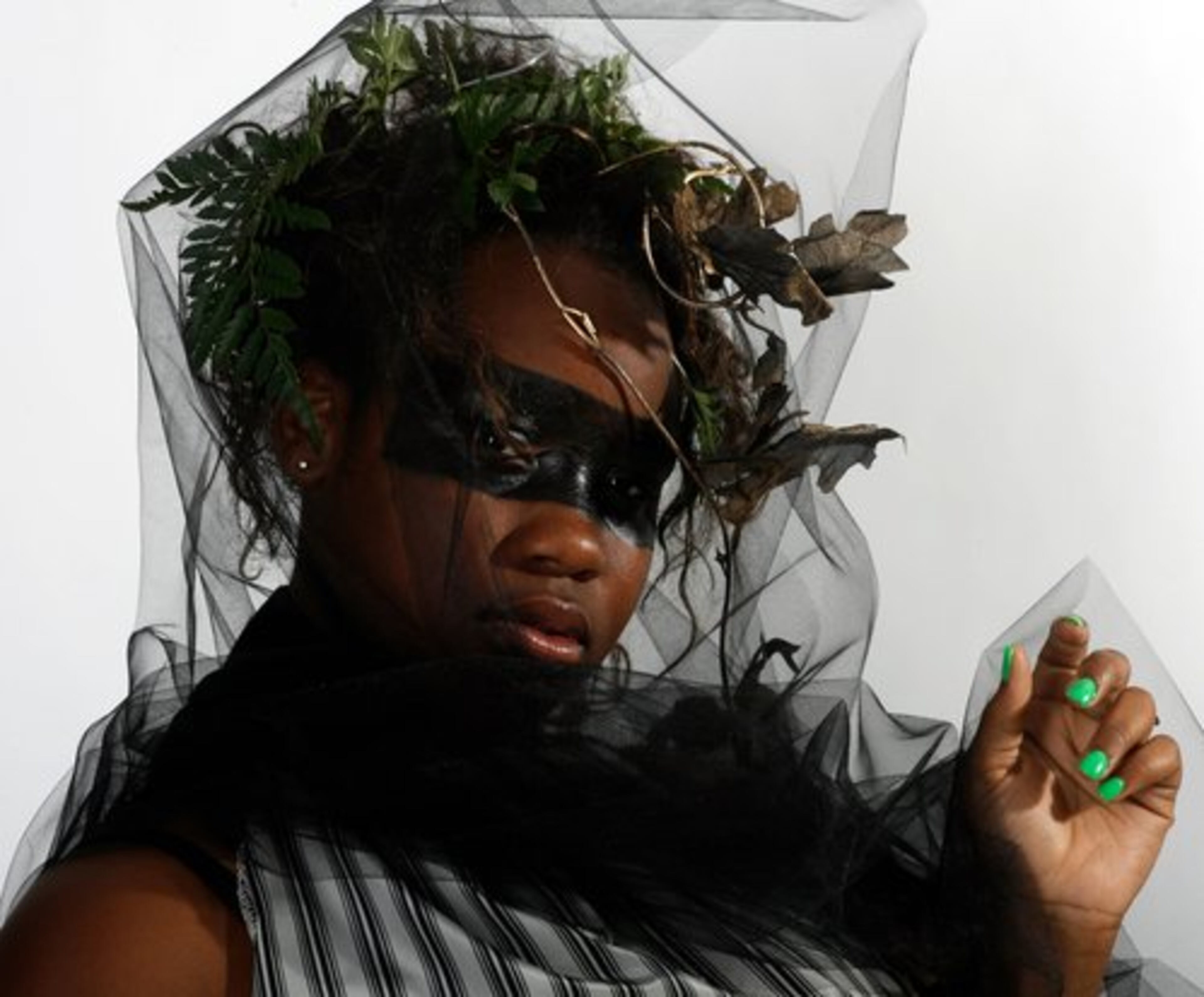 Lakisha A. Beauford designed and modeled an Atlanta tornado costume using 8 yards of fabric, a zipper, tulle and some plastic leaves.