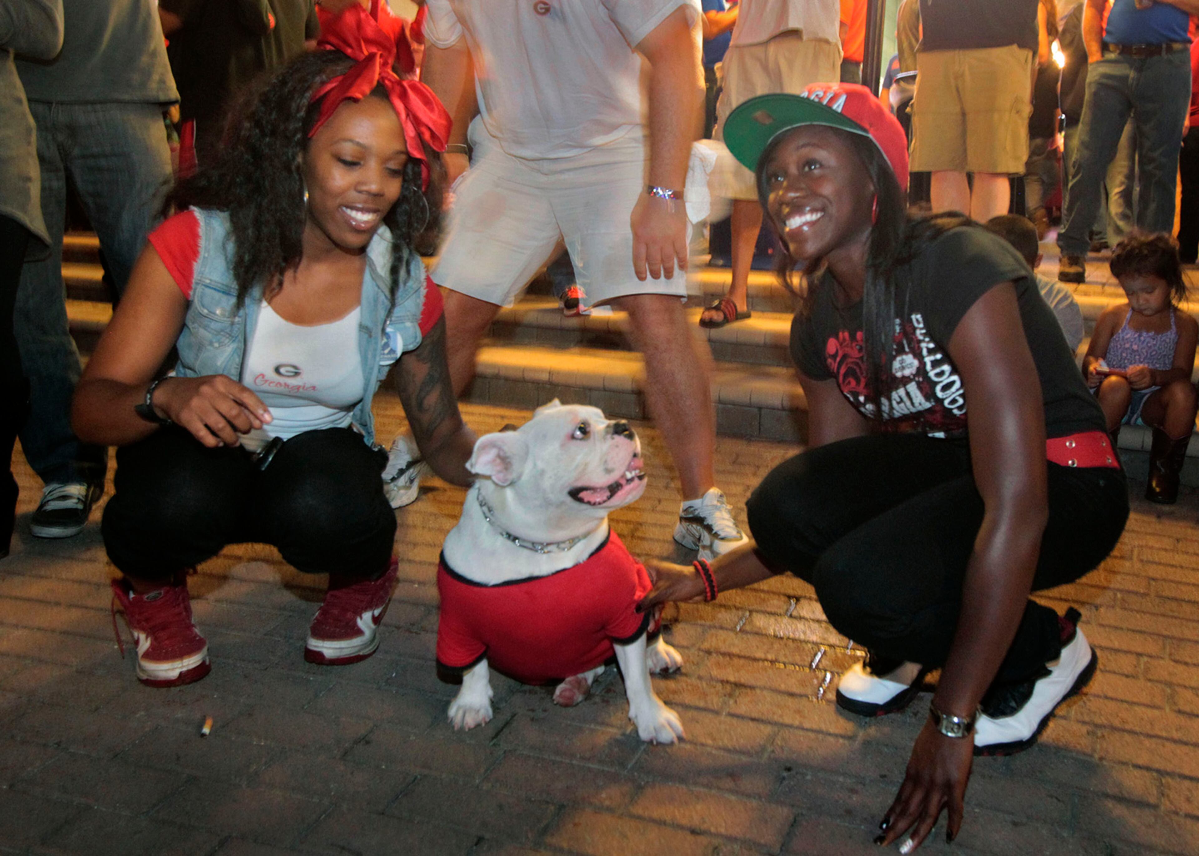 Unidentified Georgia fans check out an Uga wannabe at the Jacksonville Landing in 2012.
