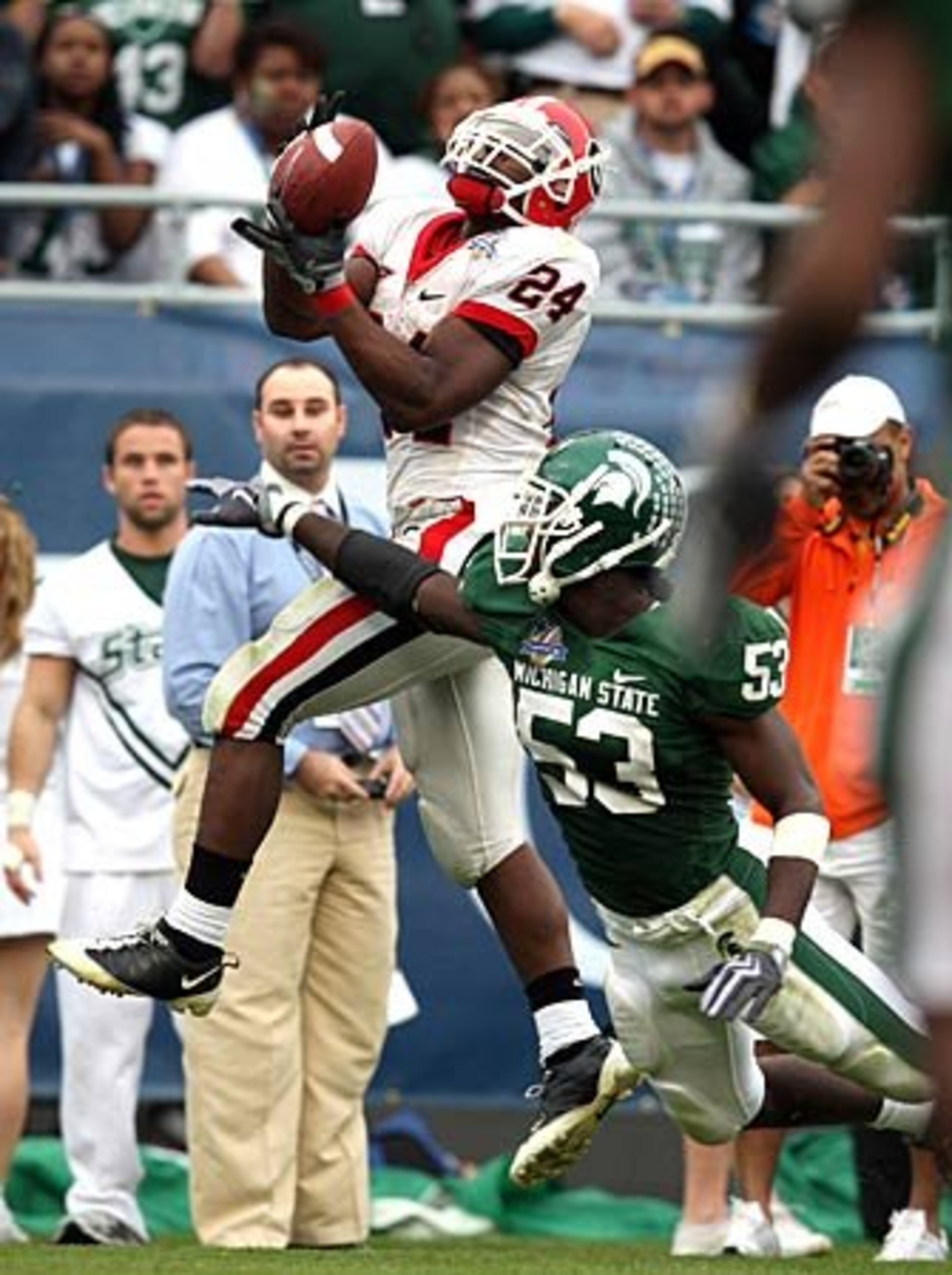 Running back Knowshon Moreno (24) grabs a touchdown in the fourth quarter in front of Michigan State linebacker Greg Jones.