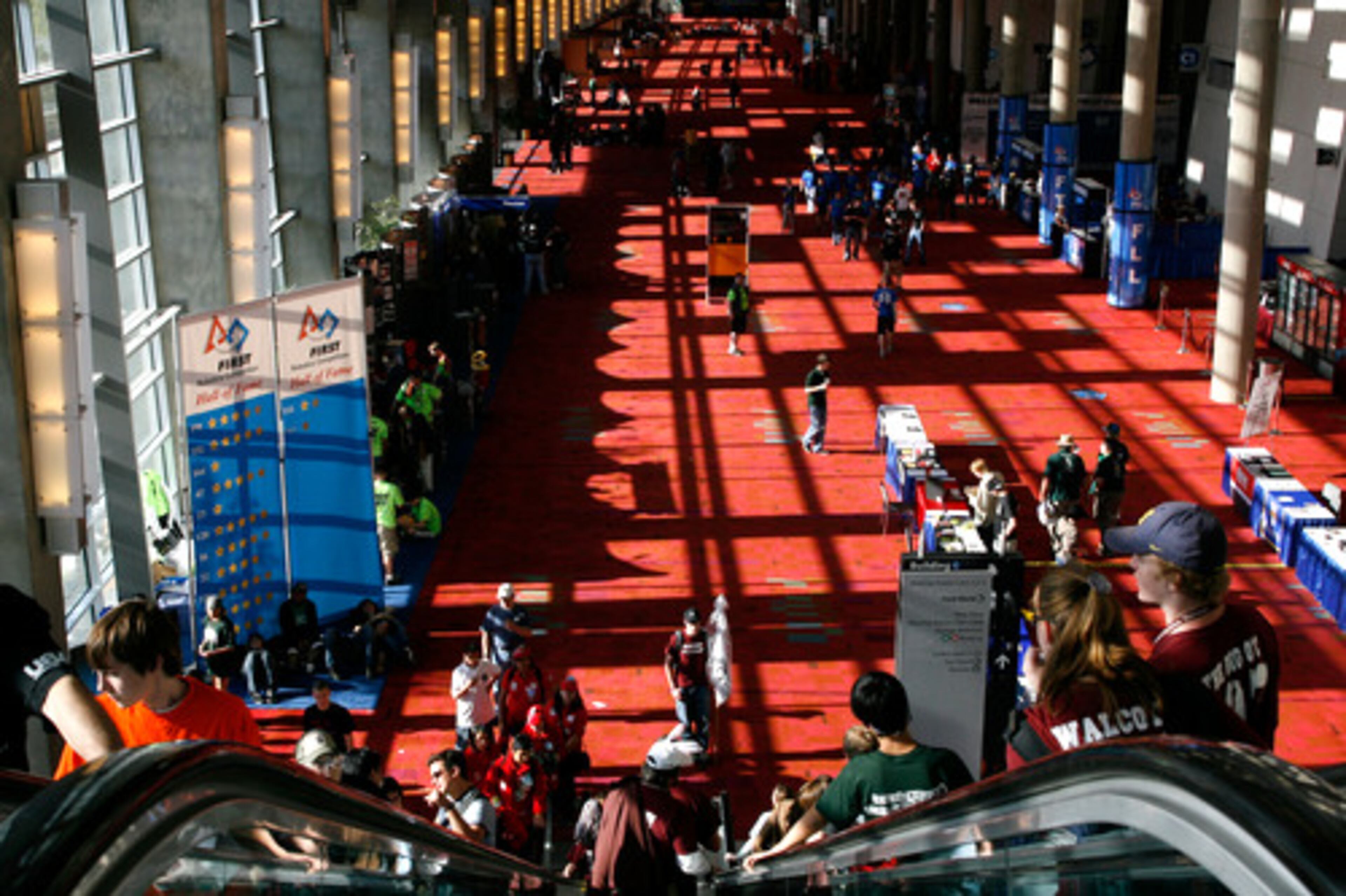 The Hall of Fame area at the GWCC for the FIRST Robotics Competition is lined with college recruiters and concessions. About 8,600 students take part in the tournament.