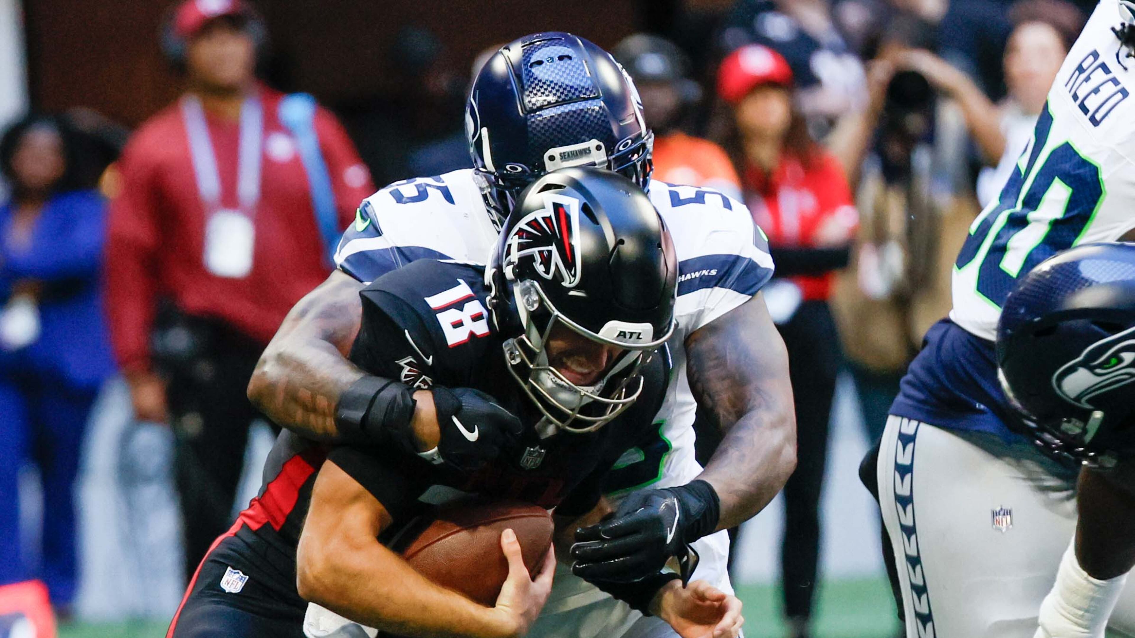 Atlanta Falcons quarterback Kirk Cousins (18) gets sacked by Seattle defensive end Dre'Mont Jones (55) during the second half of an NFL football game against the Seattle Seahawks on Sunday, October 20, 2024, at Mercedes-Benz Stadium in Atlanta.
(Miguel Martinez/ AJC)