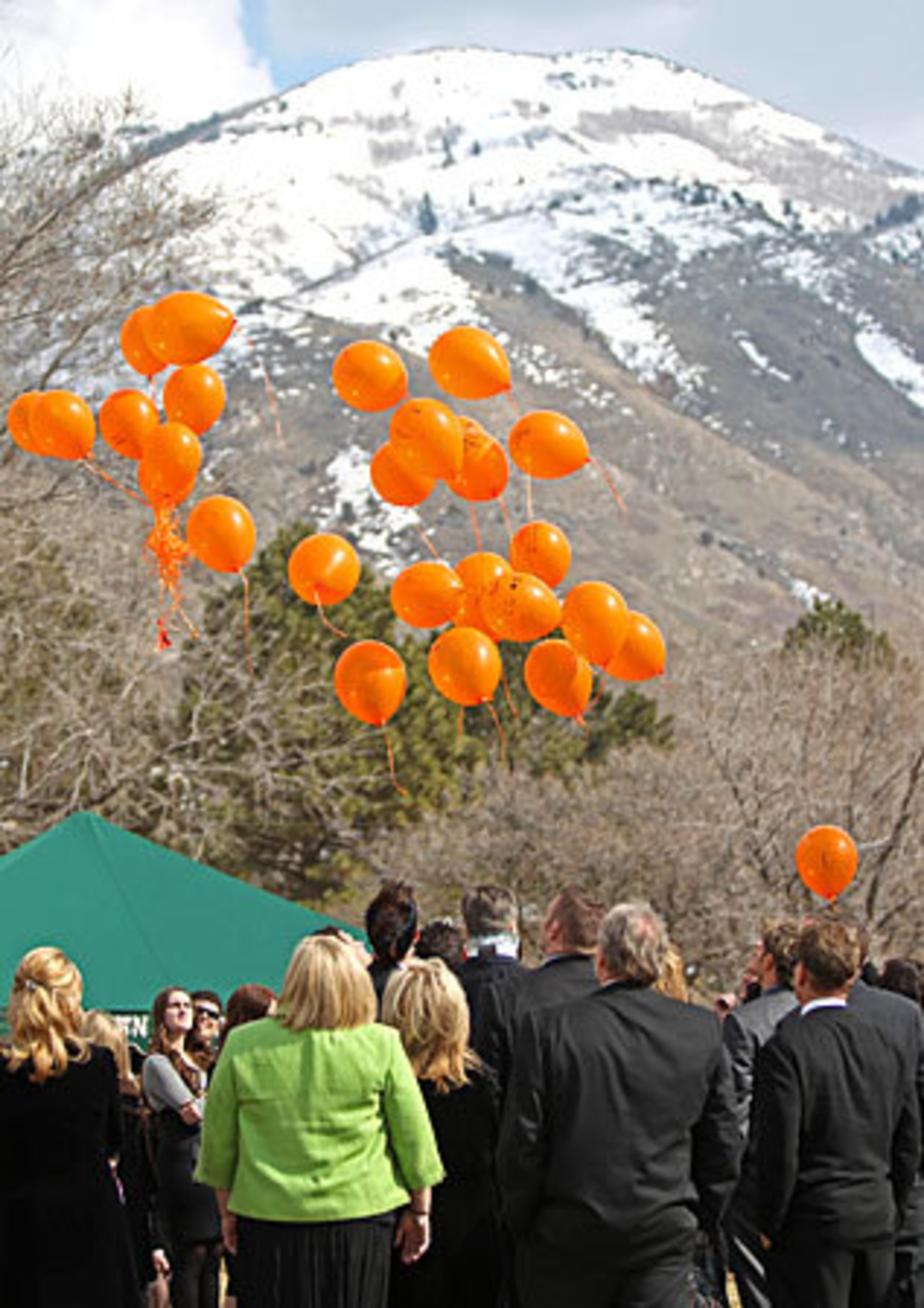 At the end of the graveside service, mourners released the balloons.