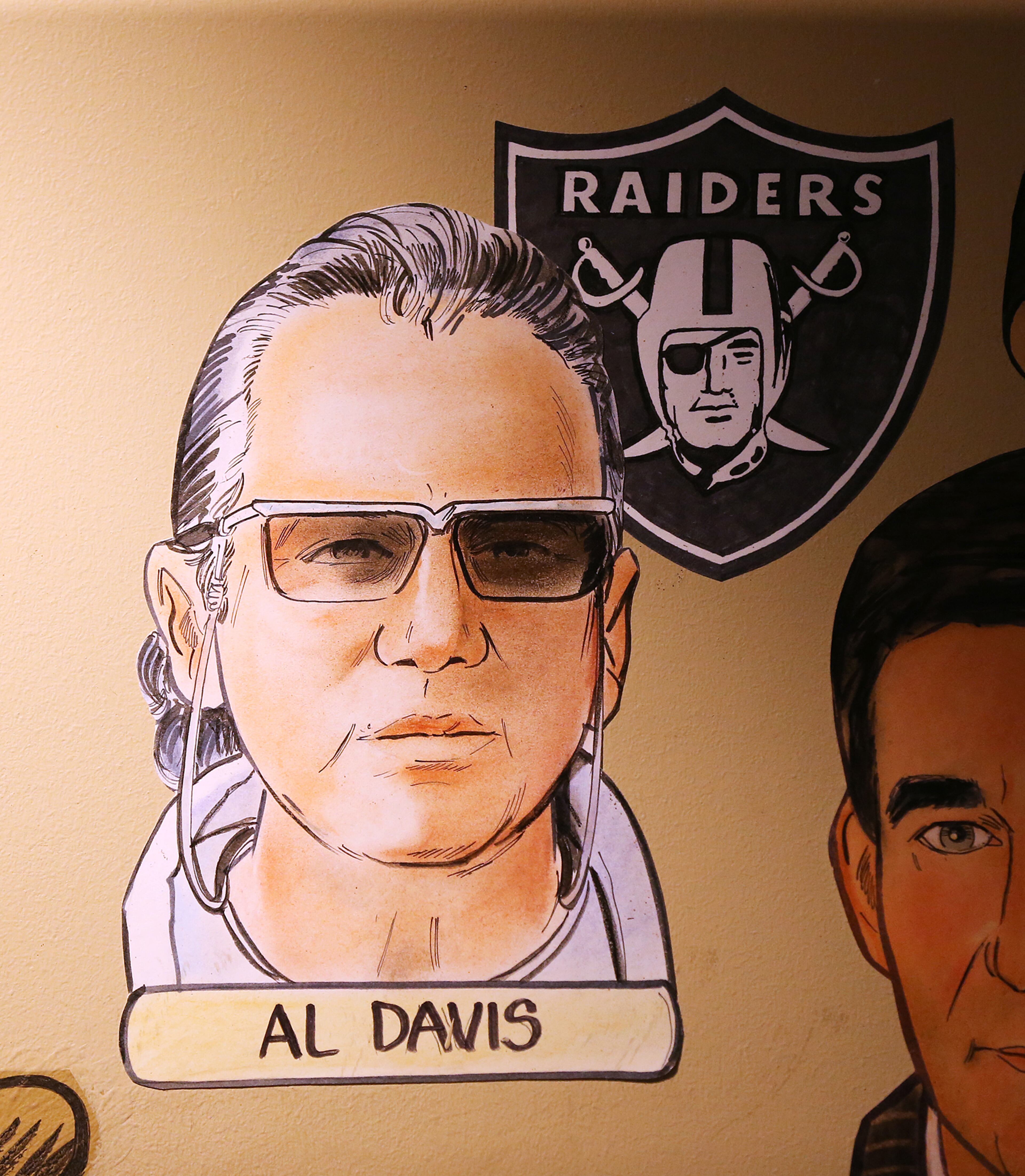 Al Davis, an American football coach and owner of the Raiders, by artist Zack Bird on the wall at the Palm restaurant in the Westin Hotel on Peachtree Street in Atlanta. Curtis Compton / ccompton@ajc.com