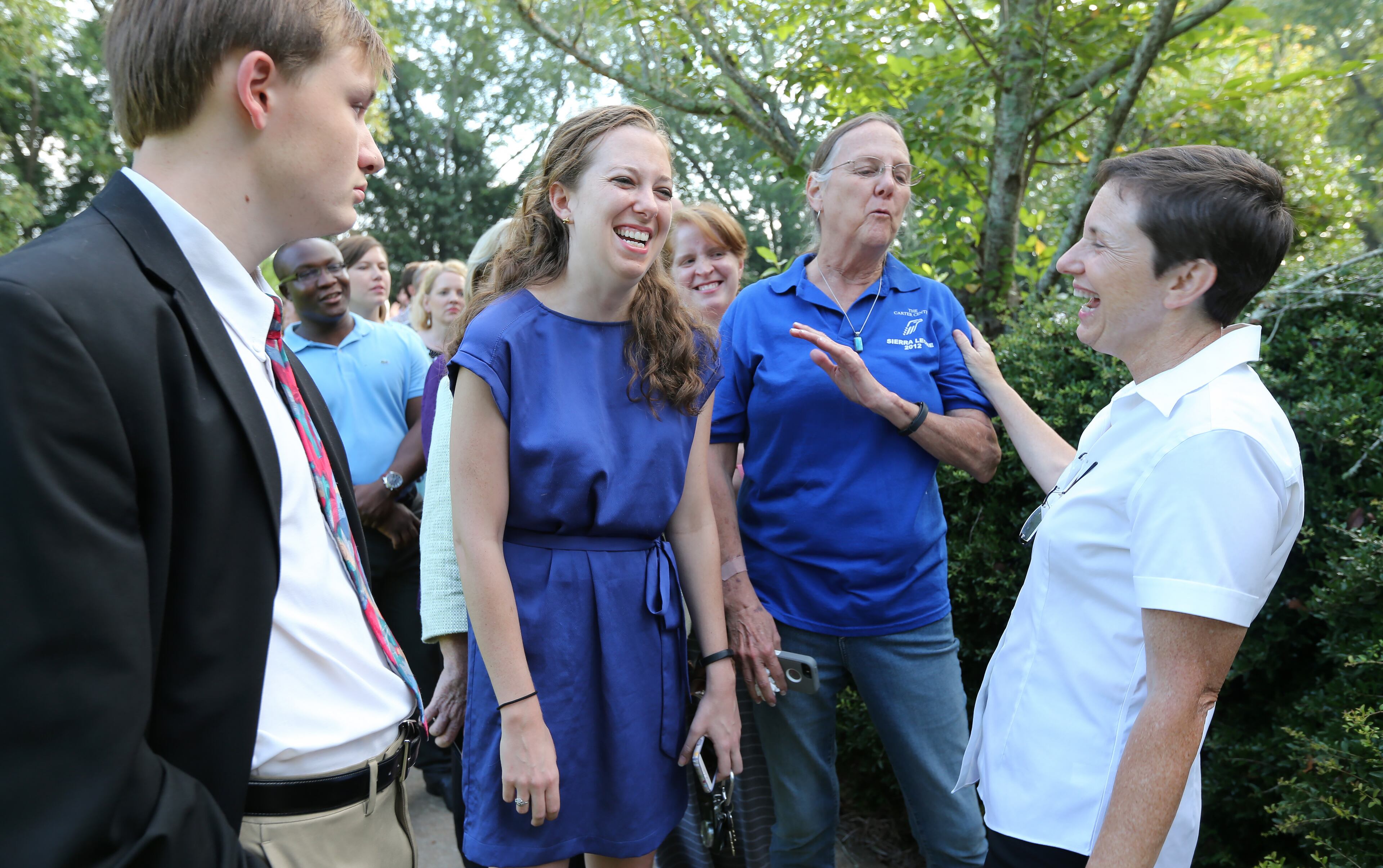 Jill Stuckey, right, keeps the mood light while informing Tyler Knierin, of Terre Haute, Indiana, from left, Laurie Murrah-Hanson and Peggy Murrah that the sanctuary was full and they wouldn't be able to sit in the sanctuary at Maranatha Baptist Church in Plains on Sunday morning August 23, 2015 forPresident Jimmy Carter's Sunday school. Some seats opened up later and the three did end up in the sanctuary. Ben Gray / bgray@ajc.com
