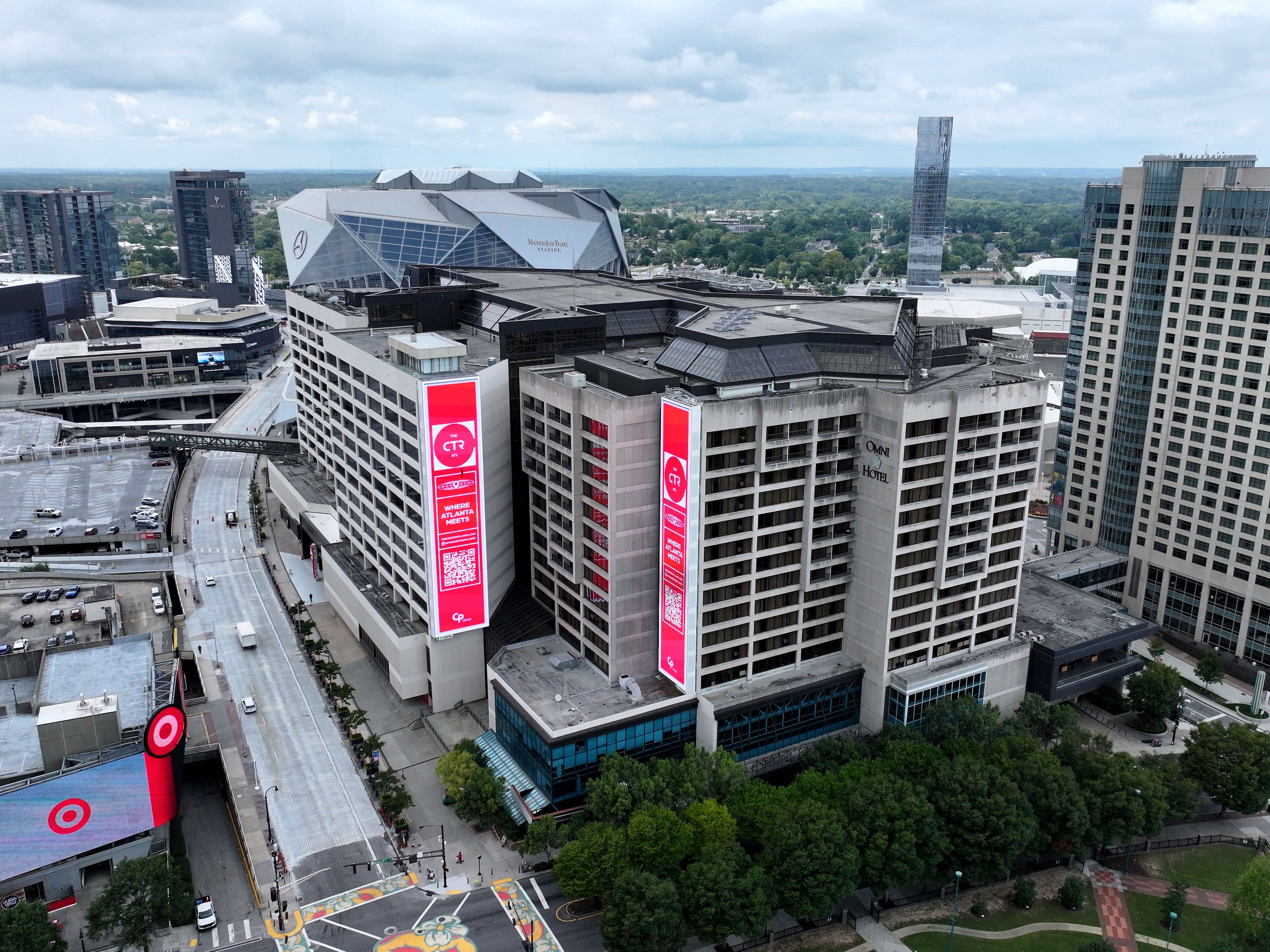 An aerial view of The Center, stylized as The CTR, at 190 Marietta St. NW. Formerly the CNN Center, the building’s owner is contemplating whether to convert some of its empty offices into apartments and hotels. (Hyosub Shin/AJC)