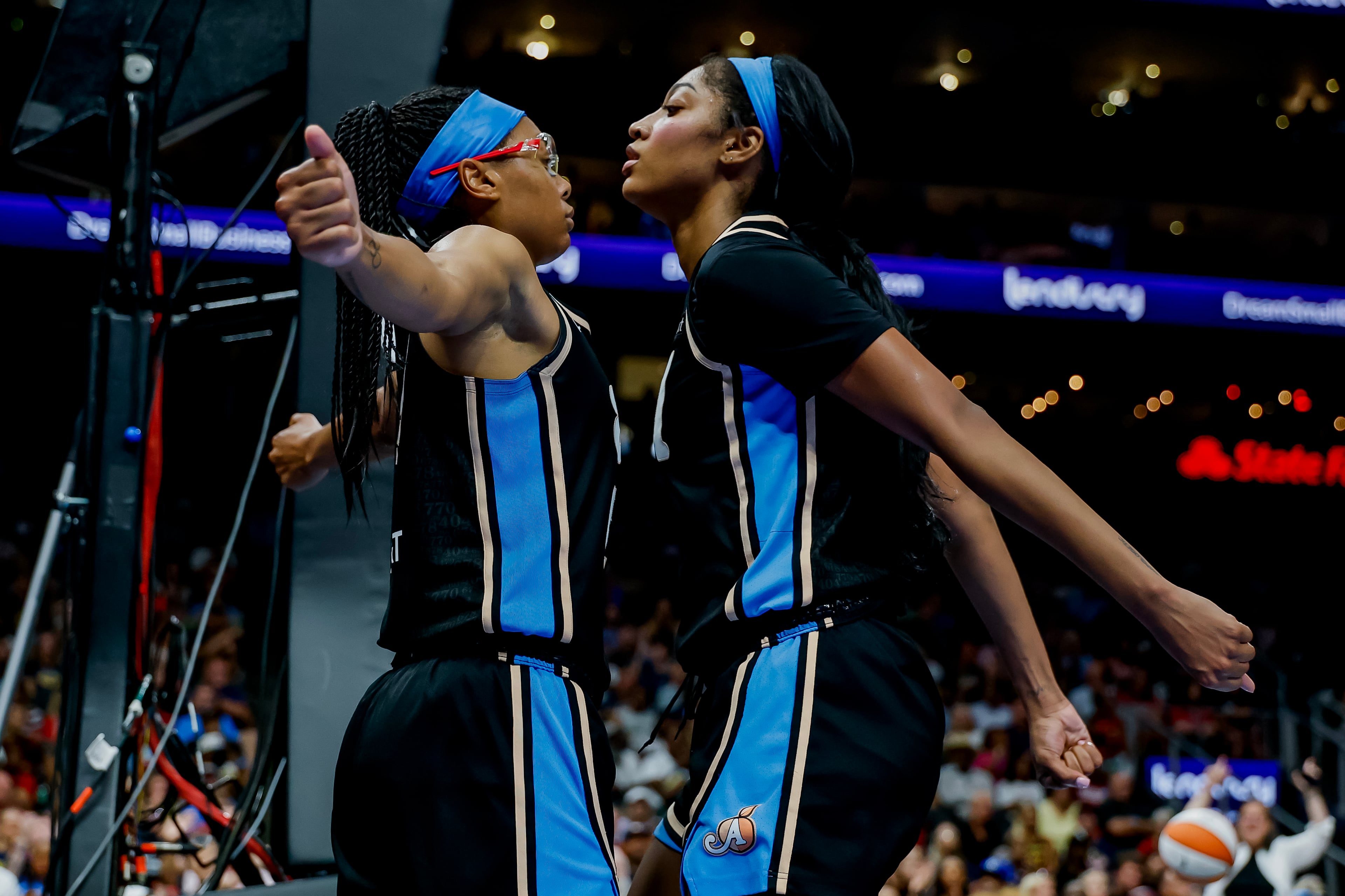 Atlanta Dream guard Allisha Gray (left) celebrates with forward Angel Reese during the game between the Atlanta Dream and the Indiana Fever. (Erik S. Lesser for the AJC)