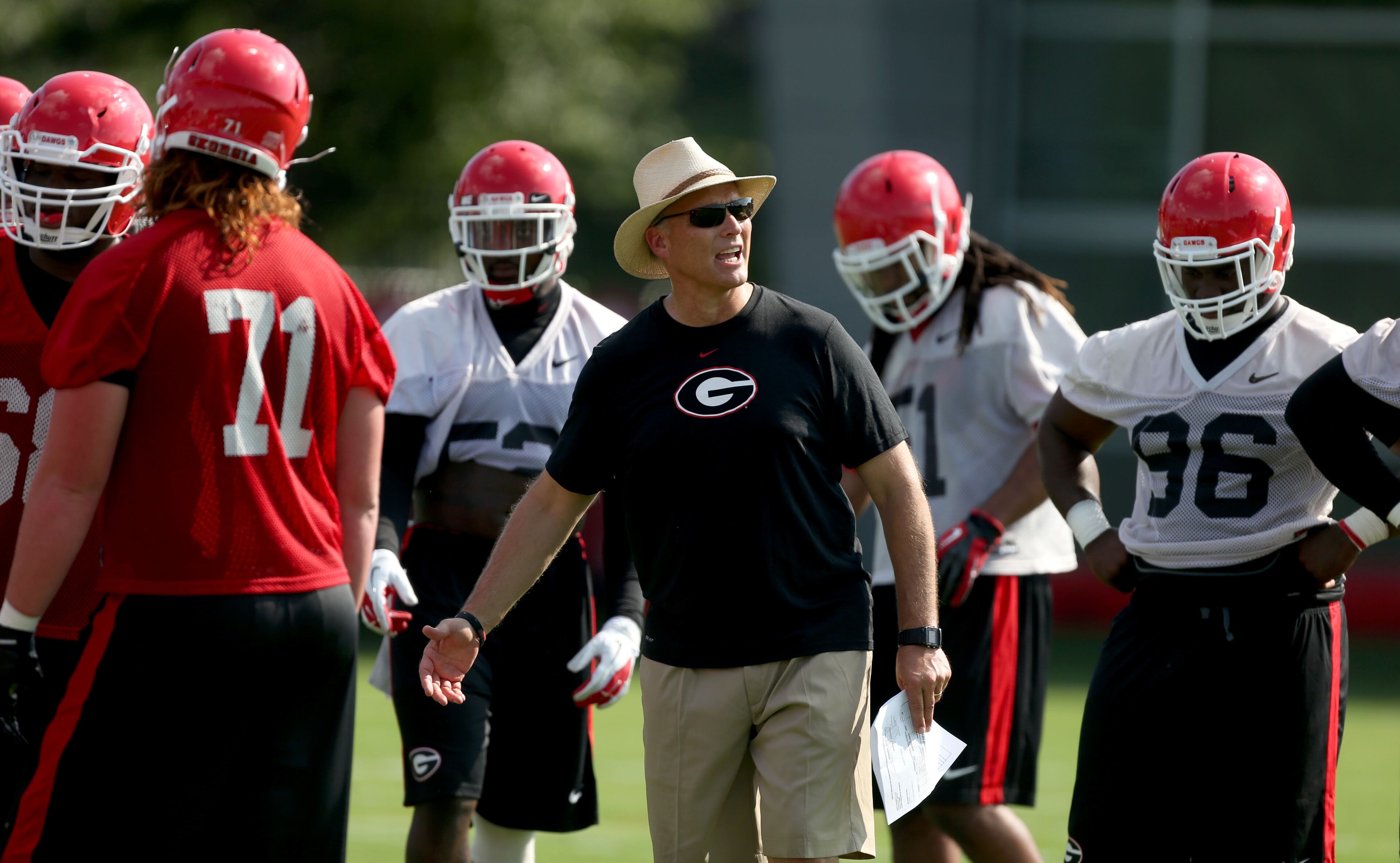 University of Georgia coach Mark Richt speaks to members of the team during first day of practice at the University of Georgia Thursday afternoon in Athens, Ga., August 1, 2013. Coach Richt is entering his 13th season as head coach of the University of Georgia. JASON GETZ / JGETZ@AJC.COM