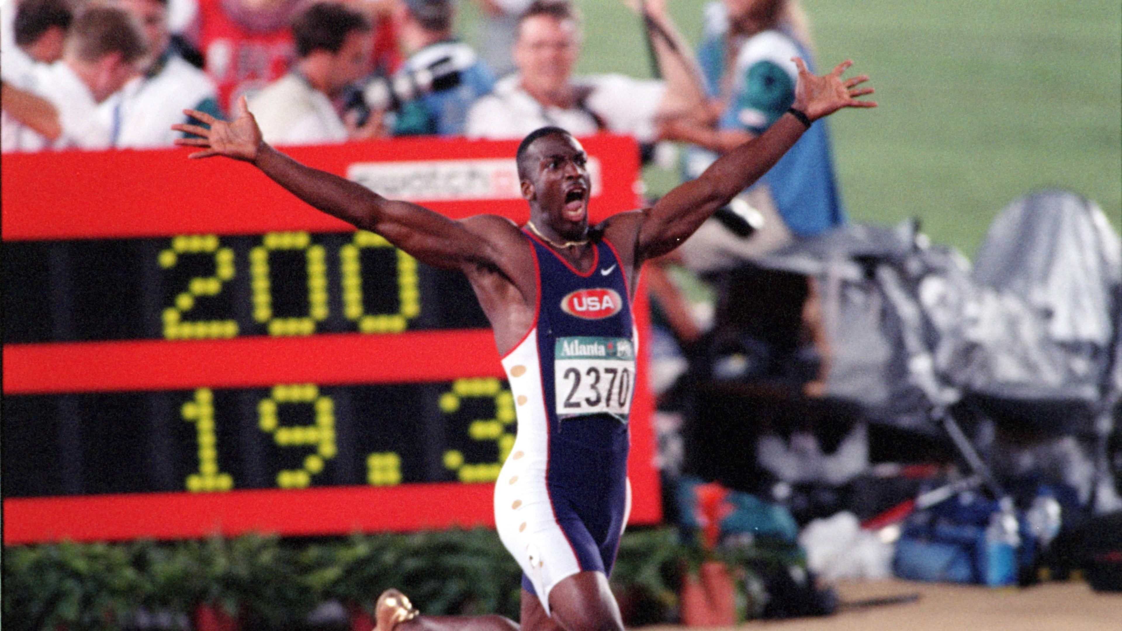 The one-word headline said "WHOOOOOOSH!," above this photo in 1996. Wearing golden shoes, Michael Johnson reacts as he realizes he has set a world record in the 200-meter event during the 1996 Summer Olympics in Atlanta. (AJC Staff Photo/Jonathan Newton)