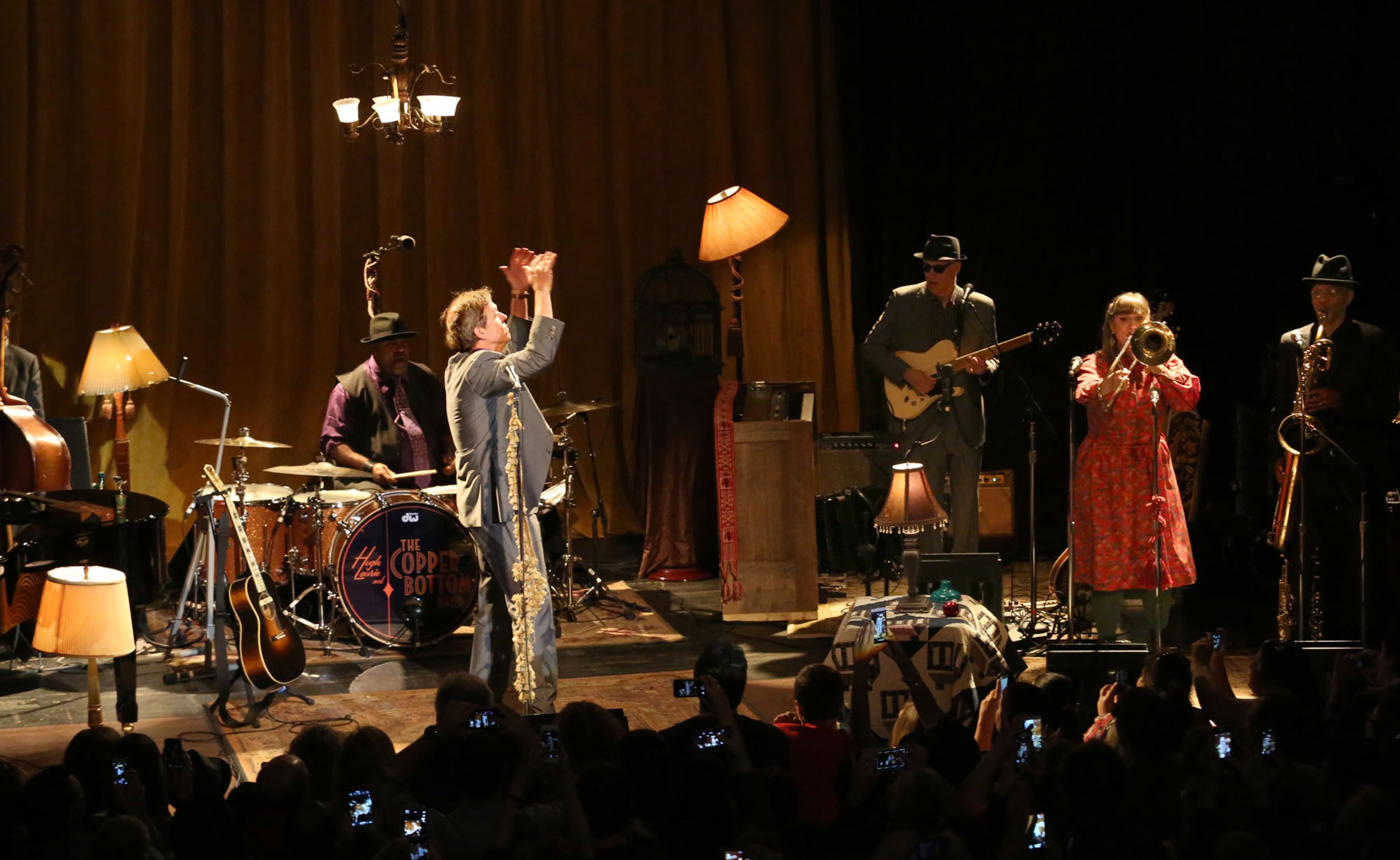 Hugh Laurie, more familiarly known as the curmudgeonly doctor from the FOX hit drama ,"House," introduces the Copper Bottom Band accompanying him for his blues performance Sunday, Nov. 3, 2013 at the Buckhead Theatre in Atlanta.