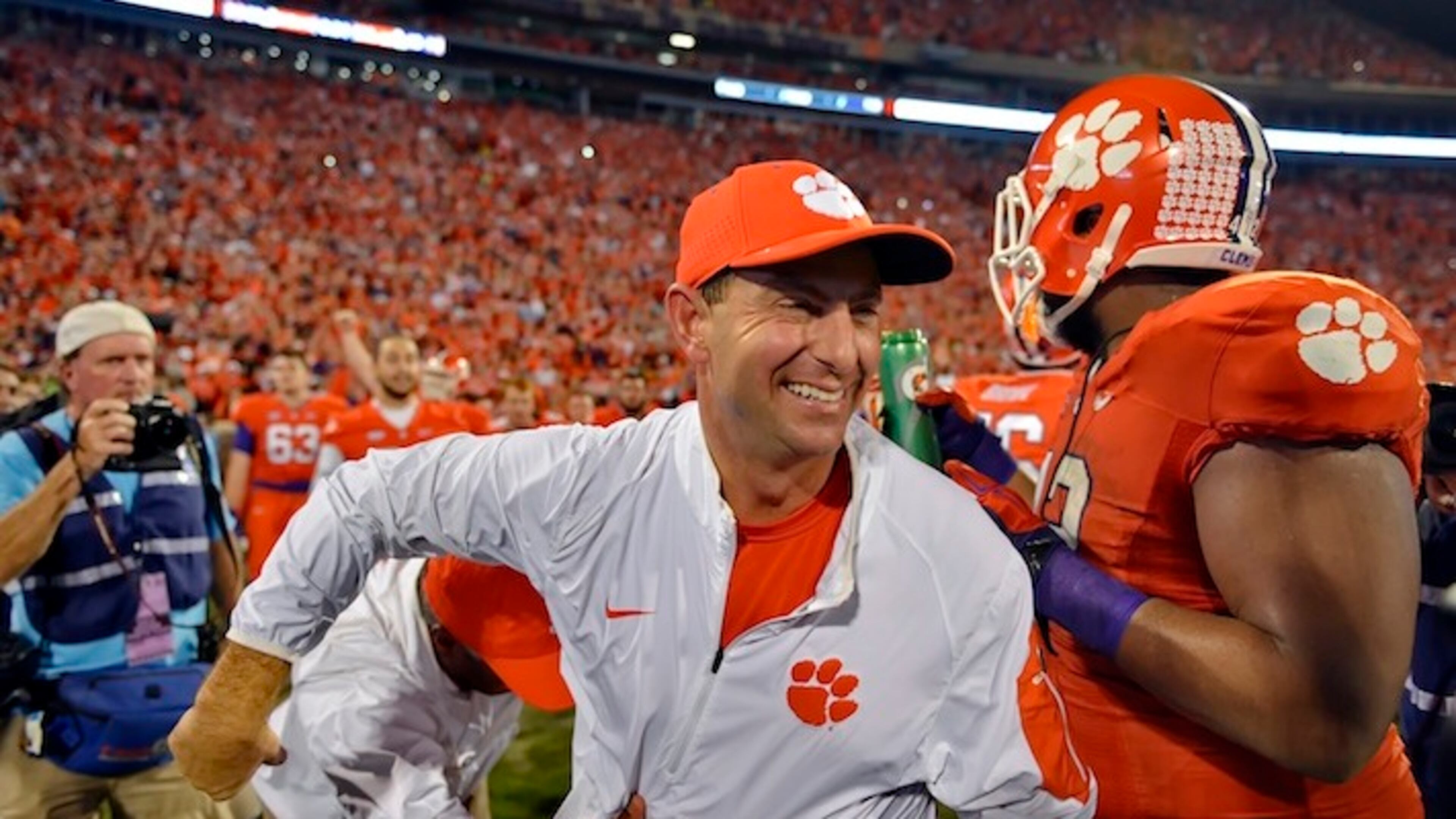 FILE - In this Nov. 7, 2015, file photo, Clemson head coach Dabo Swinney celebrates after their 23-17 win over Florida State in an NCAA college football game in Clemson, S.C. Swinney has been named the AP coach of the year, Monday, Dec. 21, after leading the Tigers to an undefeated season and spot in the College Football Playoffs. (AP Photo/Richard Shiro, File)