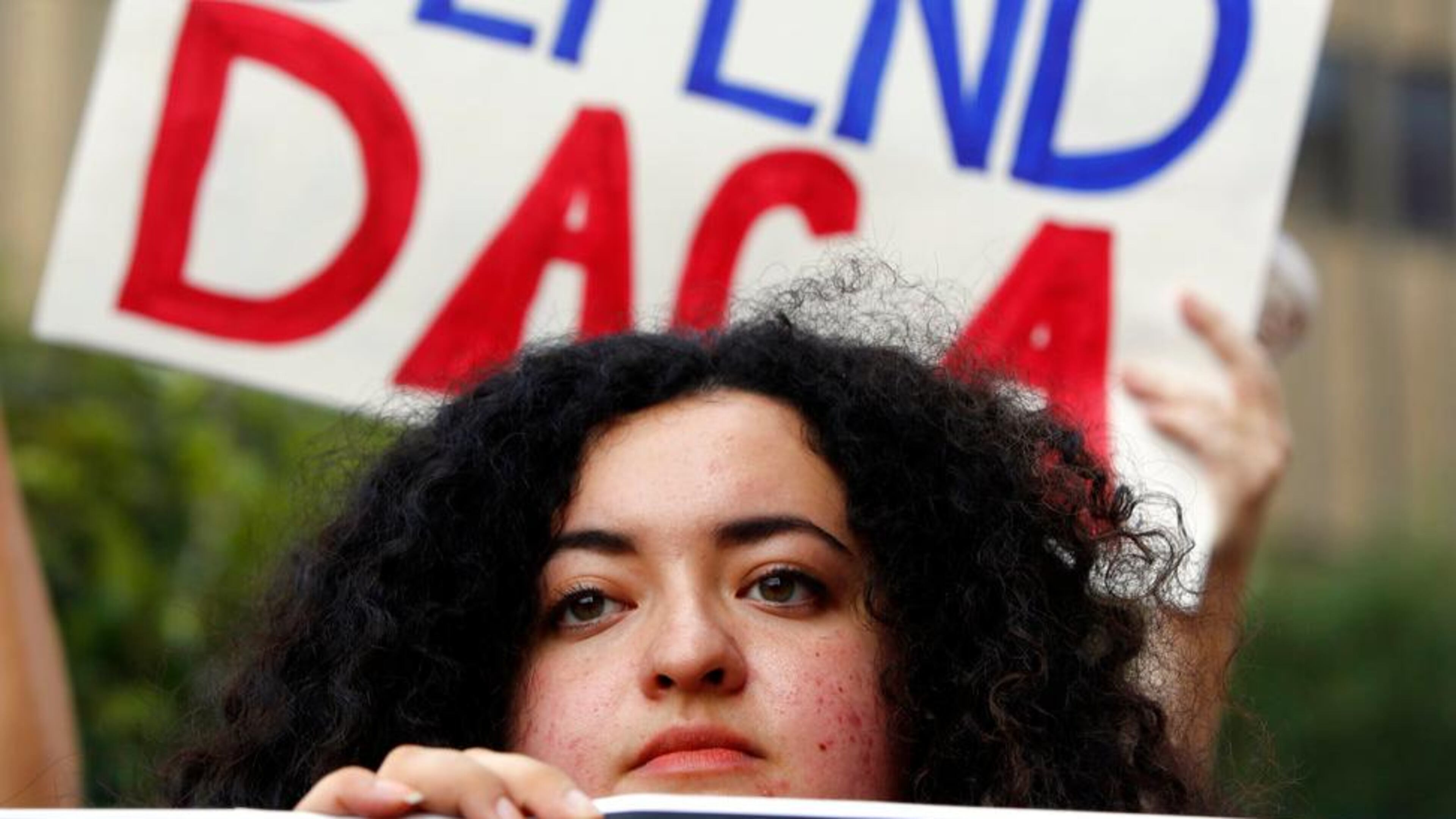 FILE - In this Sept. 1, 2017 file photo, Loyola Marymount University student and dreamer Maria Carolina Gomez joins a rally in support of the Deferred Action for Childhood Arrivals, or DACA program, outside the Edward Roybal Federal Building in Los Angeles. California Attorney General Xavier Becerra filed a lawsuit Monday, Sept. 11, against the Trump administration over its decision to end a program that protects young immigrants from deportation who were brought to the U.S. illegally as children or by parents who overstayed visas. (AP Photo/Damian Dovarganes, File)