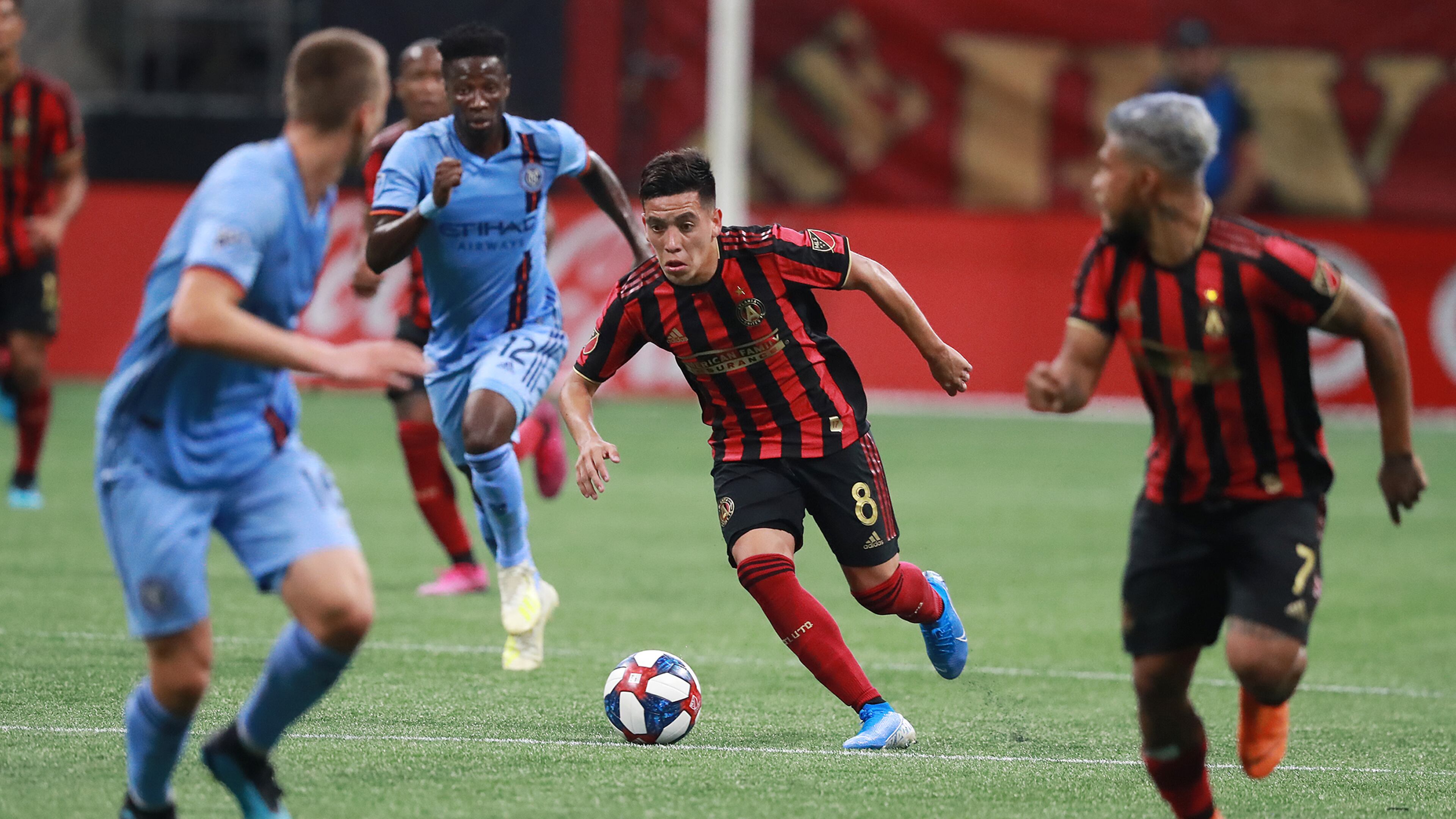 August 11, 2019 Atlanta: Atlanta United midfielder Ezequiel Barco works his way through New York City FC defenders in their soccer match on Sunday, August 11, 2019, in Atlanta. Curtis Compton/ccompton@ajc.com
