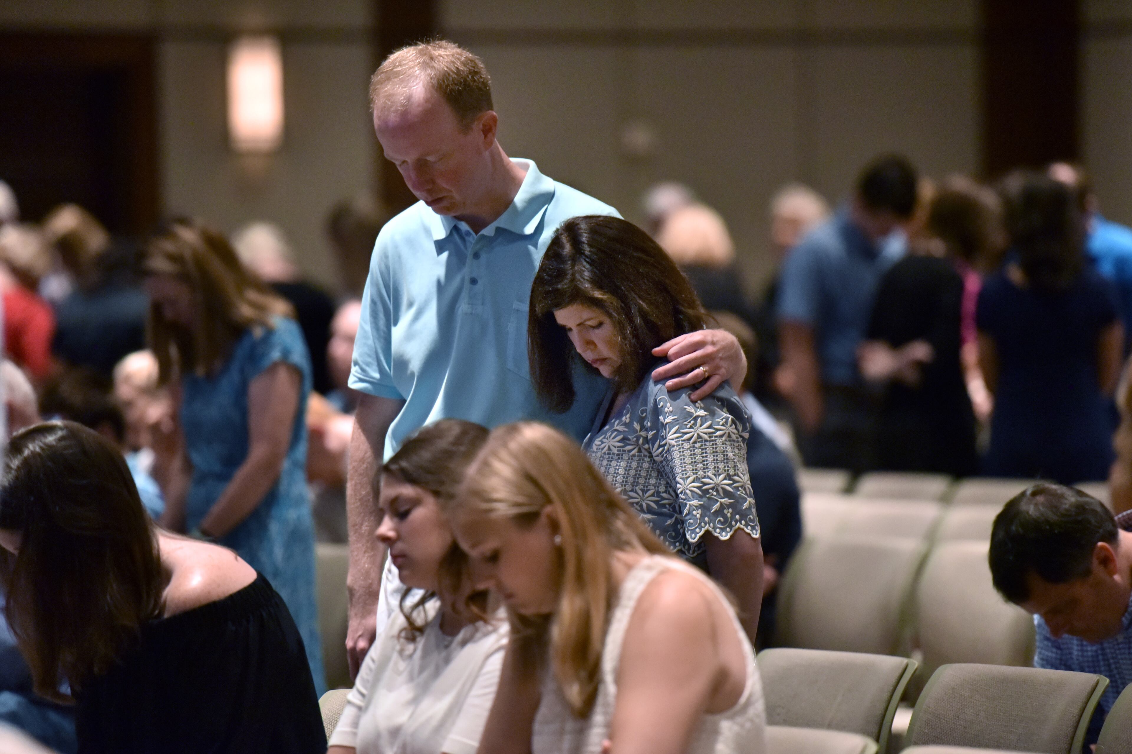 July 10, 2016 Dallas, Texas - Church members join hands as they take part in a service at Park Cities Baptist Church in Dallas on Sunday, July 10, 2016. HYOSUB SHIN / HSHIN@AJC.COM