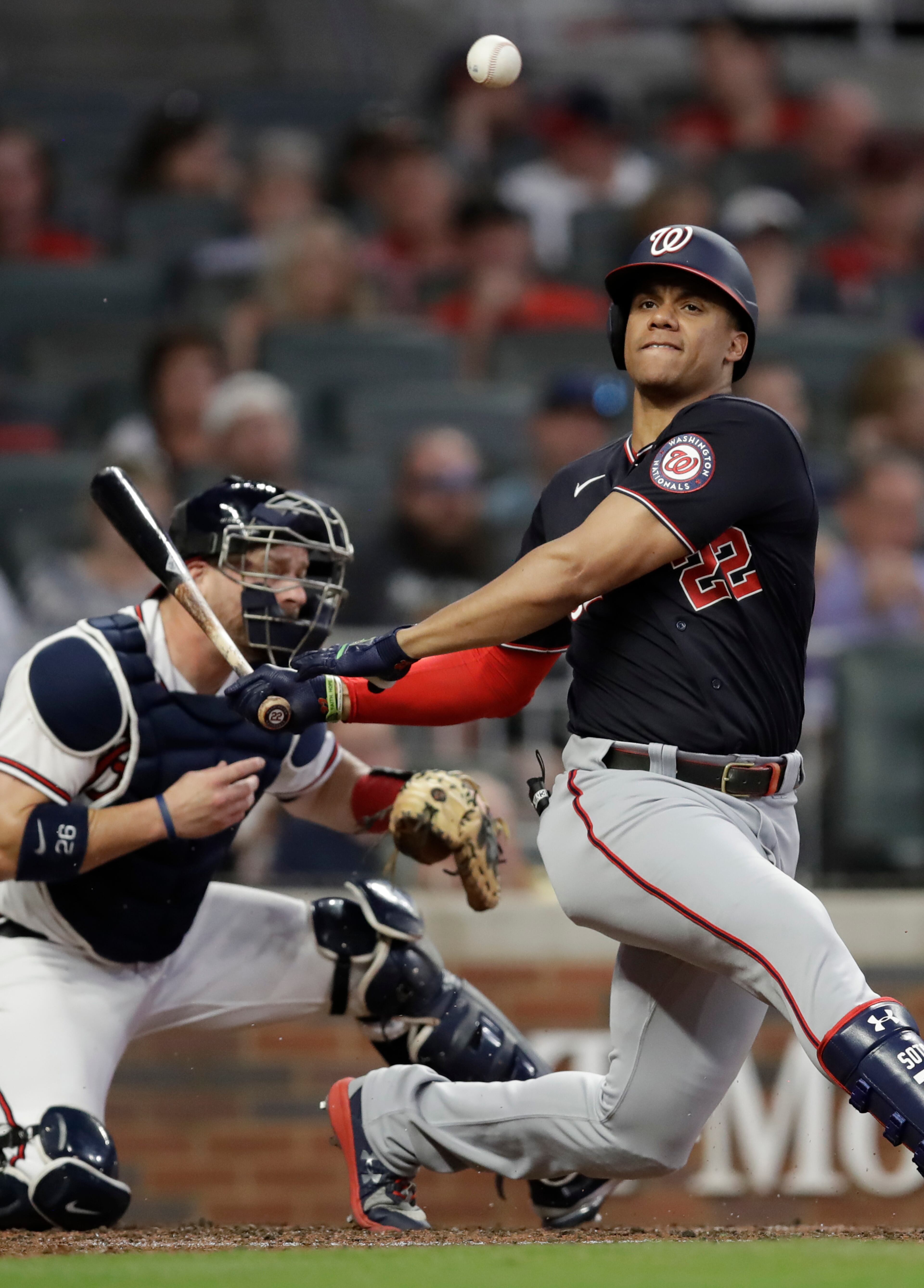 Washington Nationals' Juan Soto fouls off a pitch from the Atlanta Braves during a baseball game Thursday, Sept. 9, 2021, in Atlanta. (AP Photo/Ben Margot)