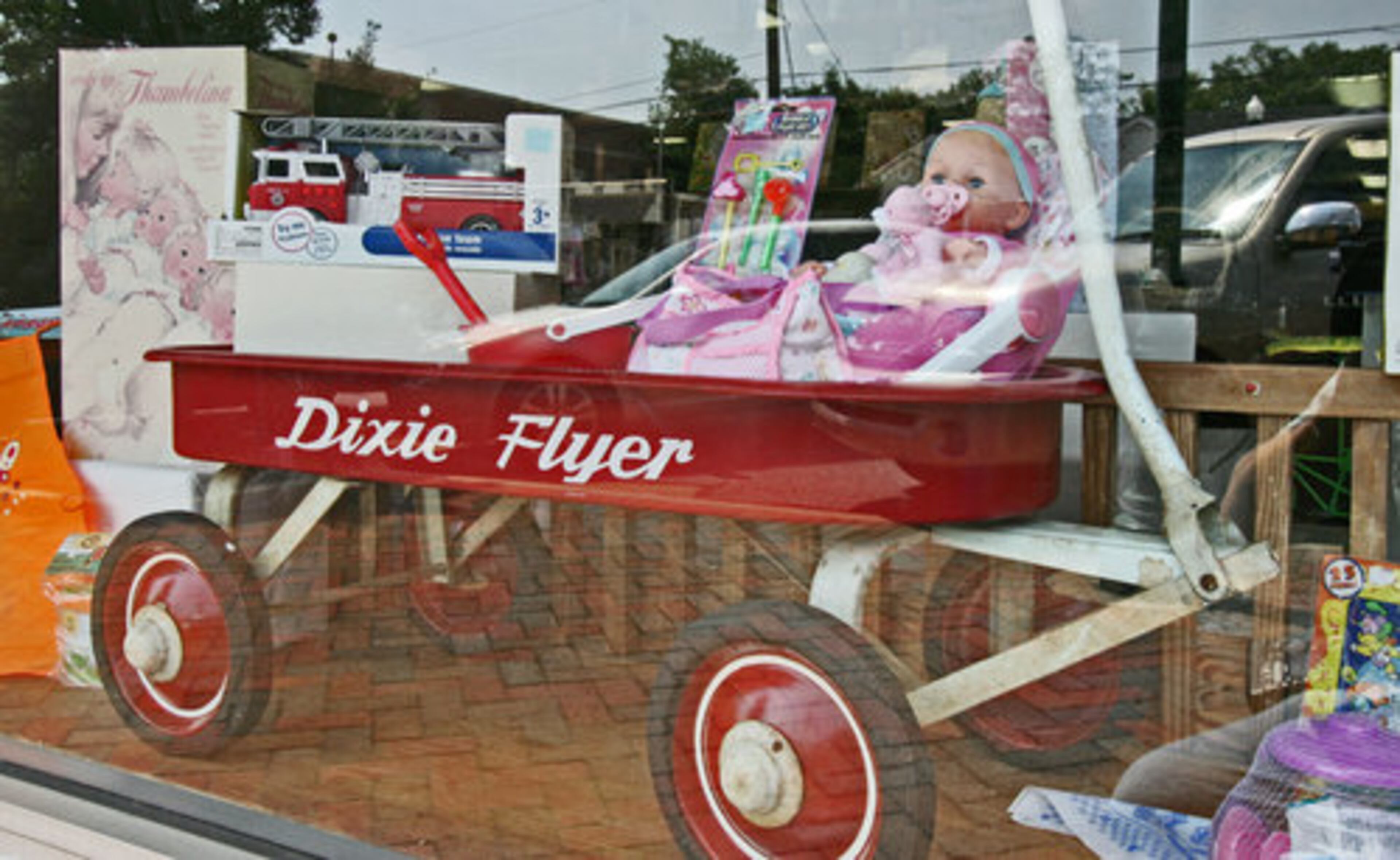 A old Dixie Flyer wagon is in the window.