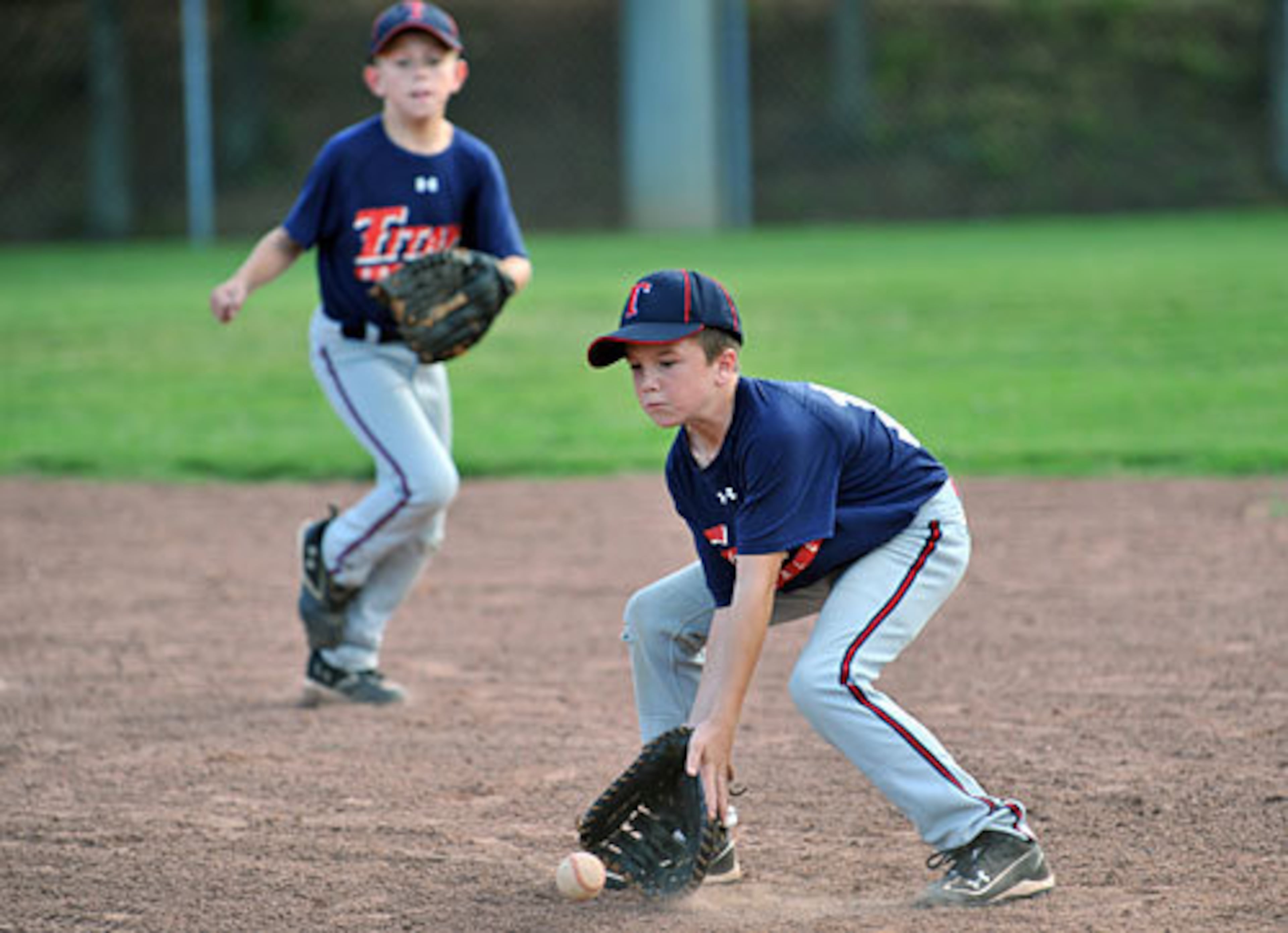 Shiloh's Harrison Stovern (right) and Jack Schuster (left) work on fielding grounders.