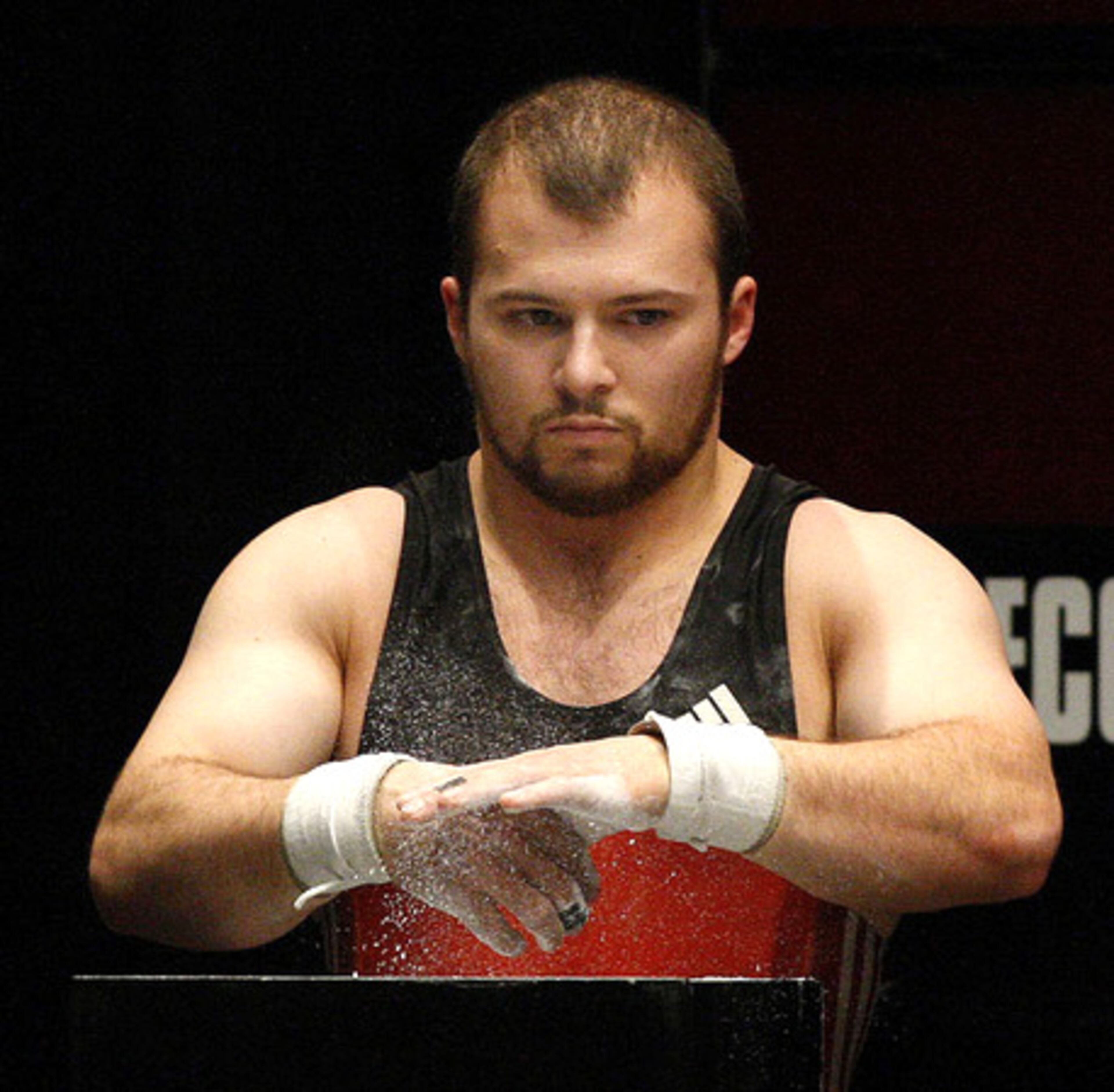Caleb William of Duluth puts on his game face while chalking up before his third lift on Friday. Winners of the competition will represent the USA at the Summer Games in China.