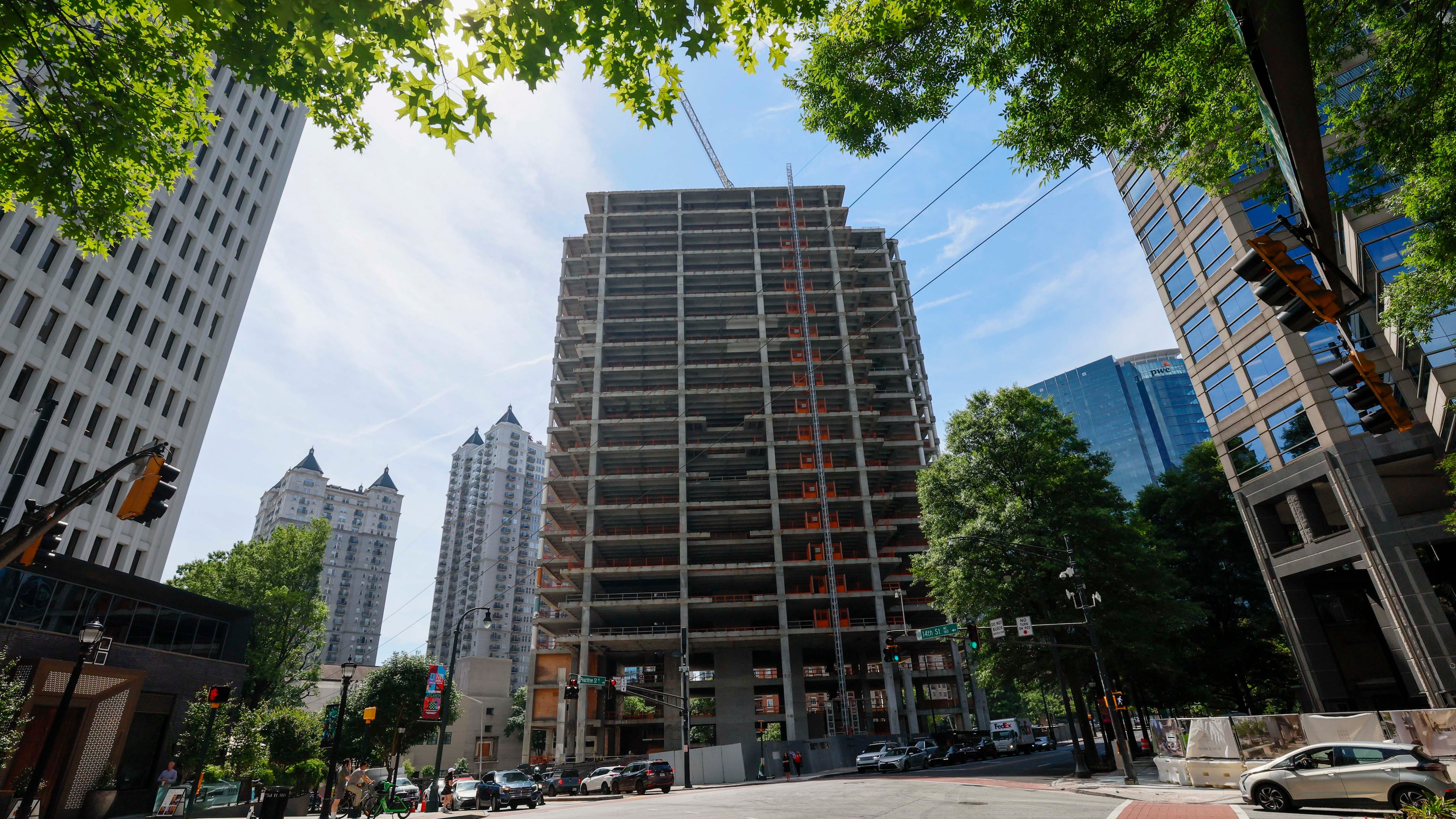 The Campanile building, a well-known Midtown construction site, has remained incomplete for years. Local residents are unhappy with the slow progress, and some city officials have taken notice. (Miguel Martinez/AJC)