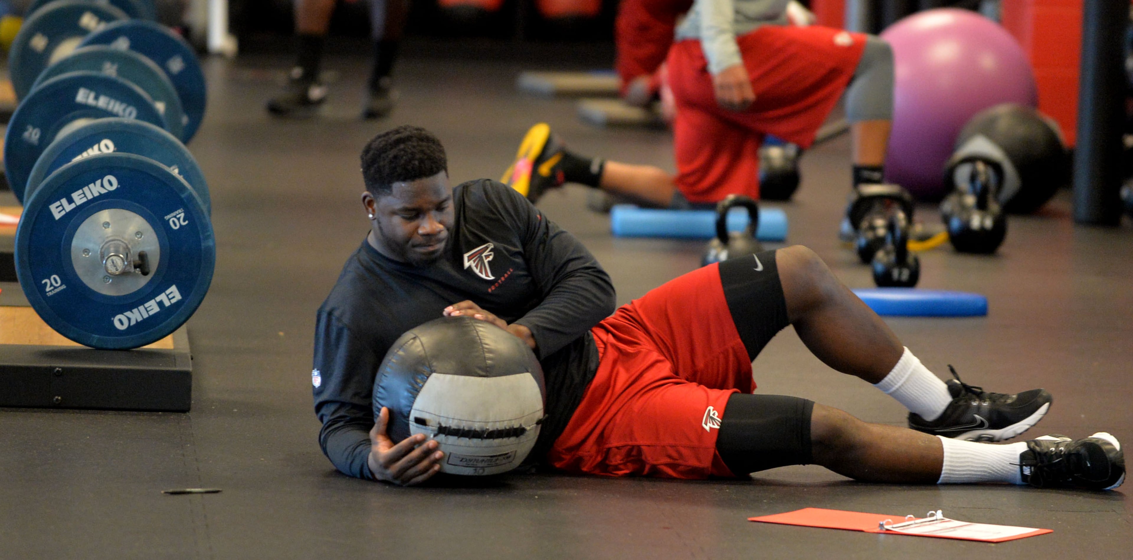 Falcons linebacker Sean Weatherspoon stretches in the weight room at the team's headquarters in Flowery Branch on Tuesday, April 22, 2014.