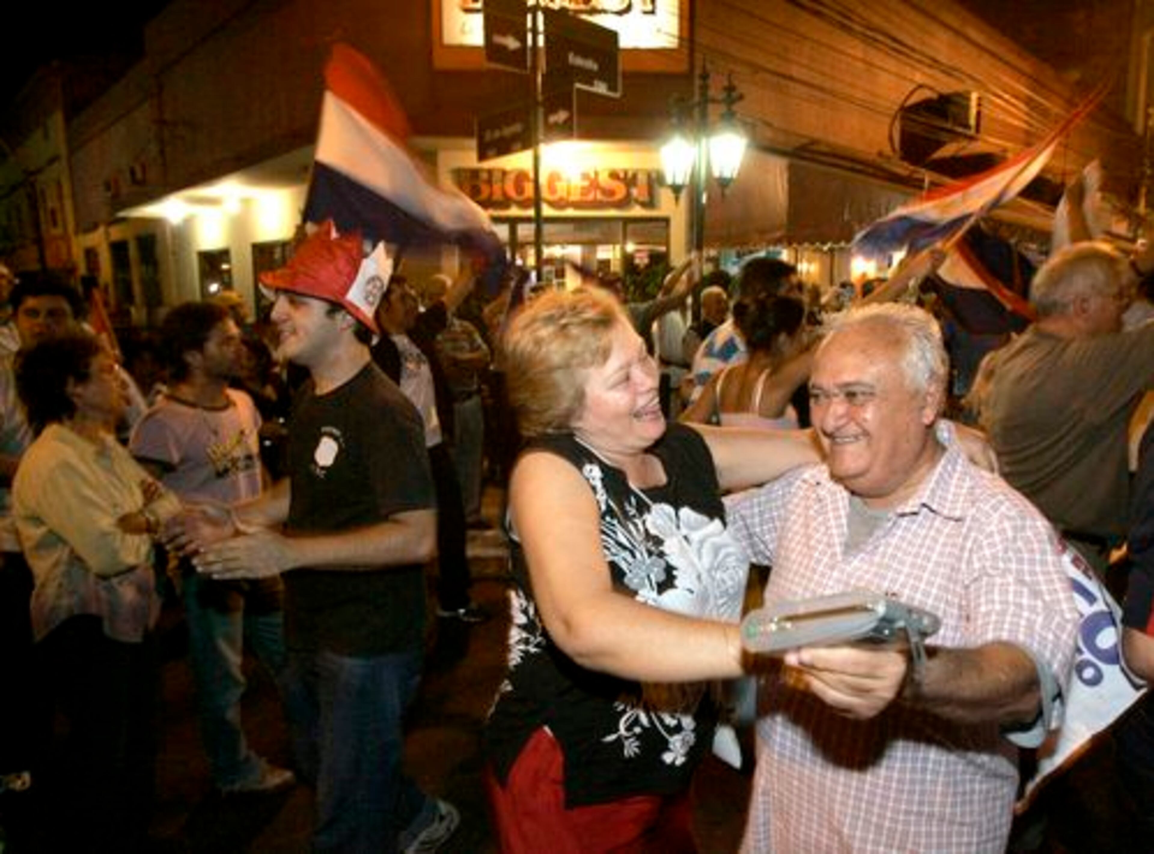 Supporters of presidential candidate and former Roman Catholic Bishop Fernando Lugo celebrate after opponent Blanca Ovelar concedes defeat in Asuncion, Paraguay, on Sunday. The world's longest-ruling political party lost its six-decade grasp on power with the presidential victory of the former bishop.