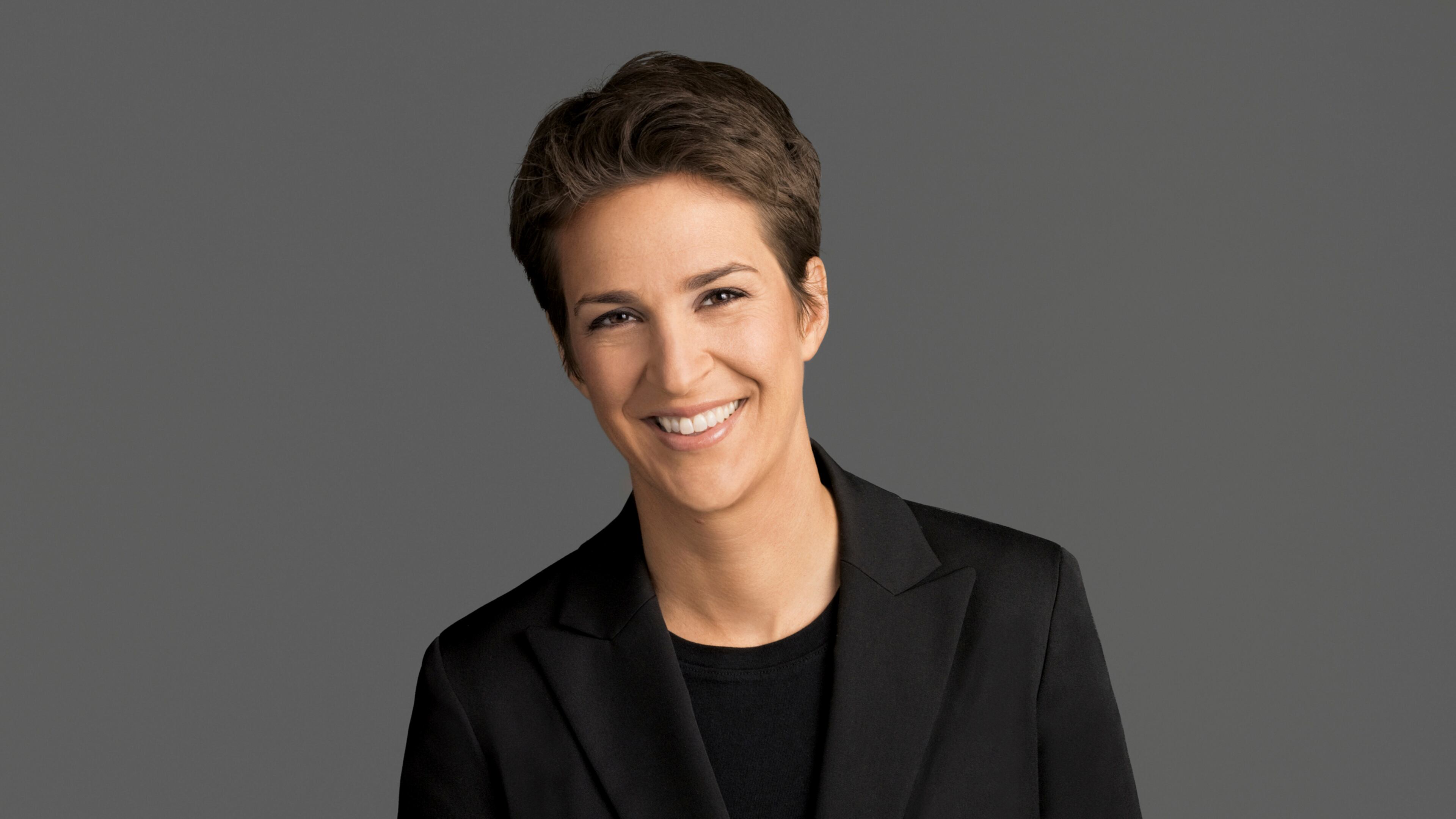 This image released by NBC shows Rachel Maddow, host of "The Rachel Maddow Show," on MSNBC. Maddow was at the center of the political media universe Tuesday, March 14, 2017, with a story on President Donald Trump’s tax returns. (MSNBC via AP)