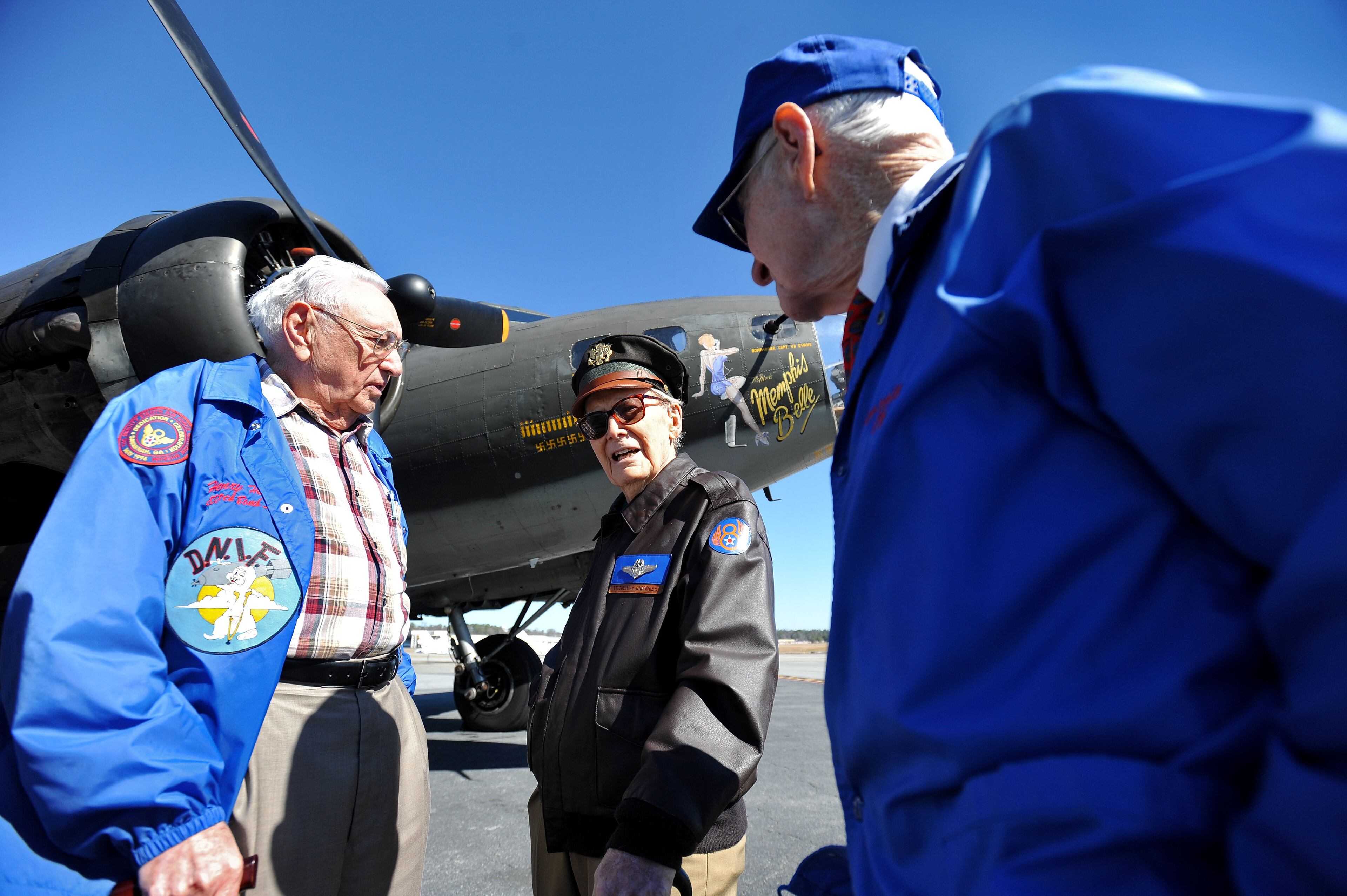 WWII aviators, from left, Henry Hughey, Hap Chandler and Al McMahan, who count 142 European missions among themselves, reminisce before taking a flight in a restored B-17 Flying Fortress named the "Movie Memphis Belle" at DeKalb-Peachtree Airport on Monday, Feb. 24, 2014, in Atlanta. The Liberty Foundation, based in Douglas, will open its 2014 flying season with flying tours in the Atlanta area this weekend. (AP Photo/David Tulis)